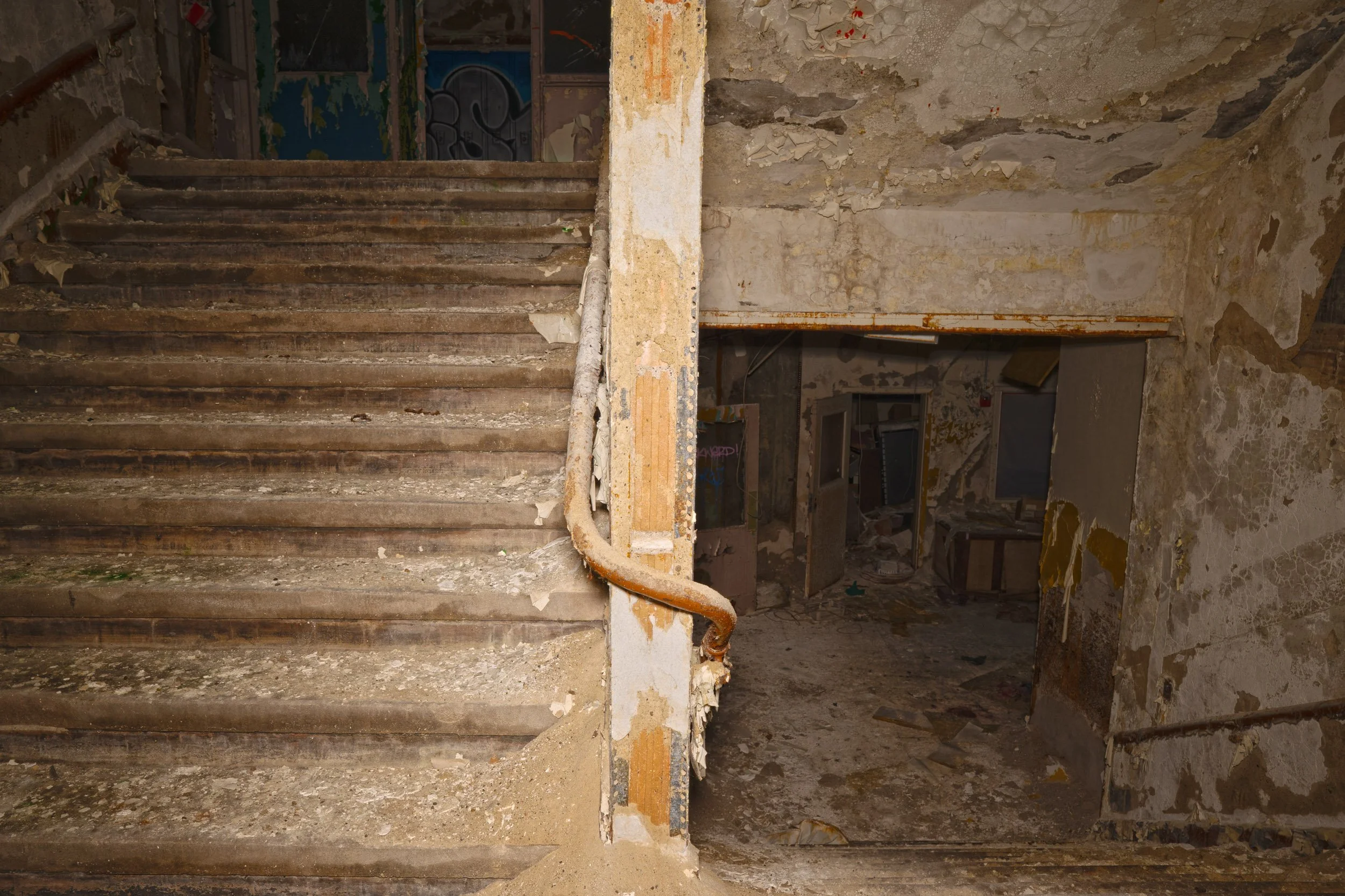 side stairwell leading to 2nd floor above and 1st floor below