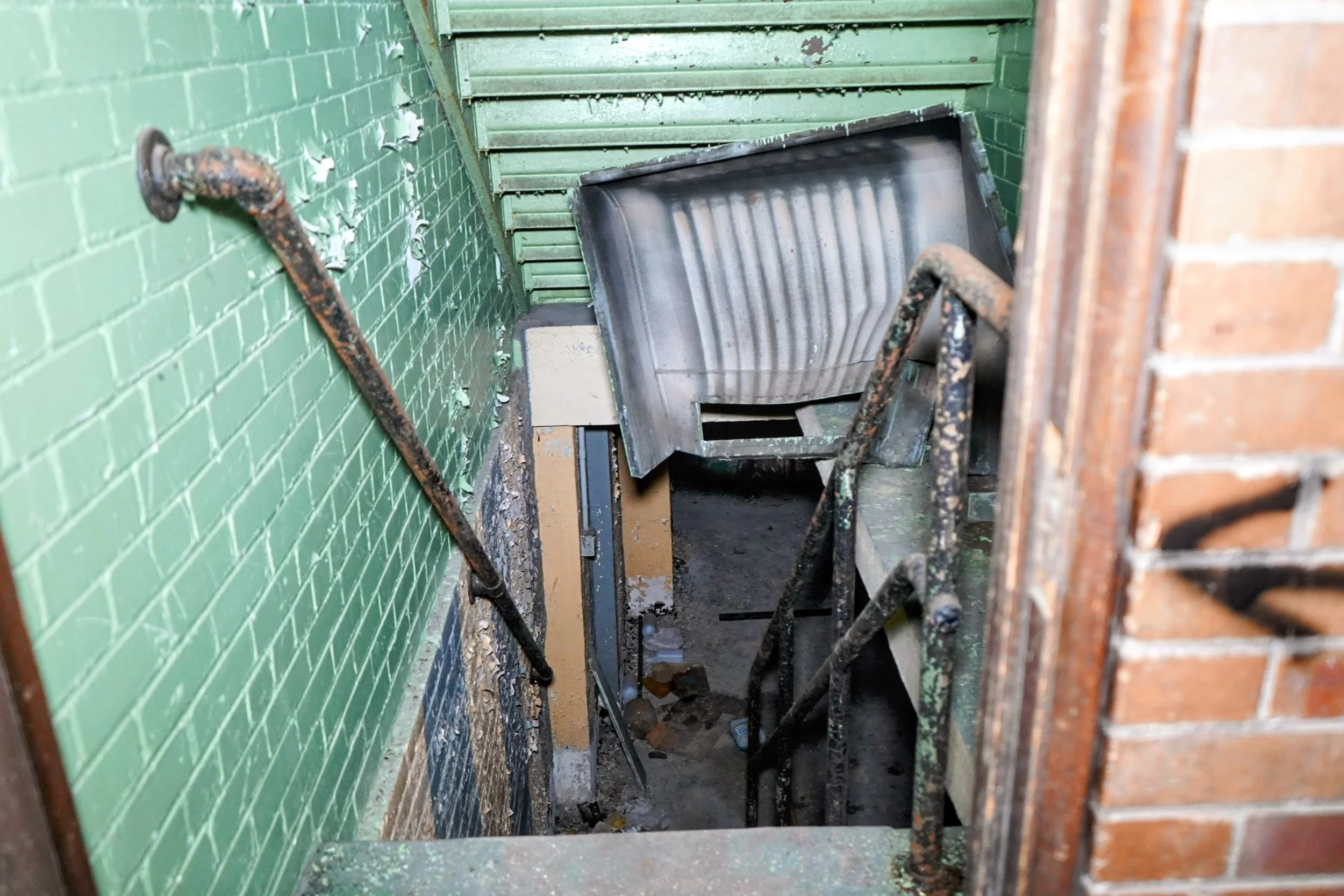 basement level labeled in demolition markings as "tunnel access"