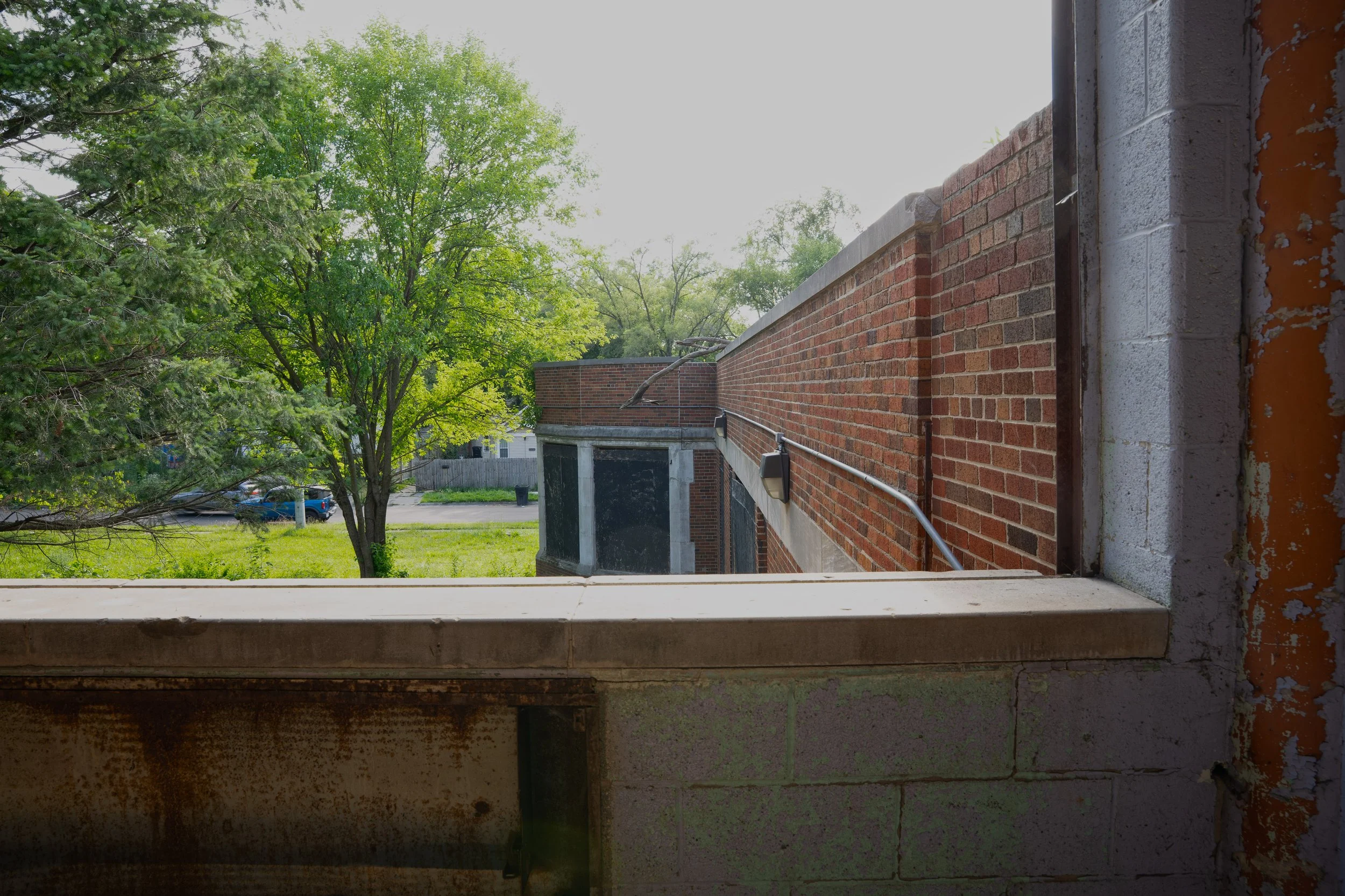 Good view of the 1925 building from a 2nd floor window the bay window of the kindergarten room is visible