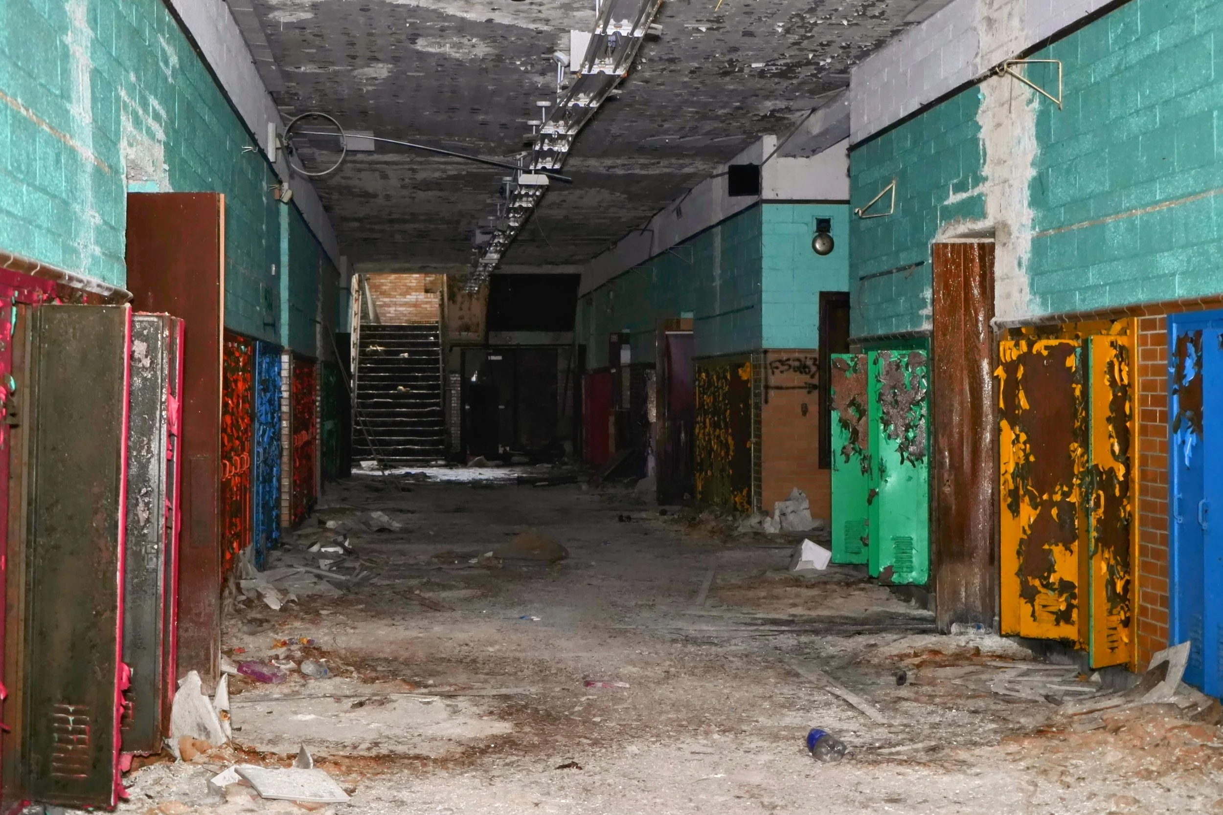 The hallway are lined with a nice teal over brick bottom