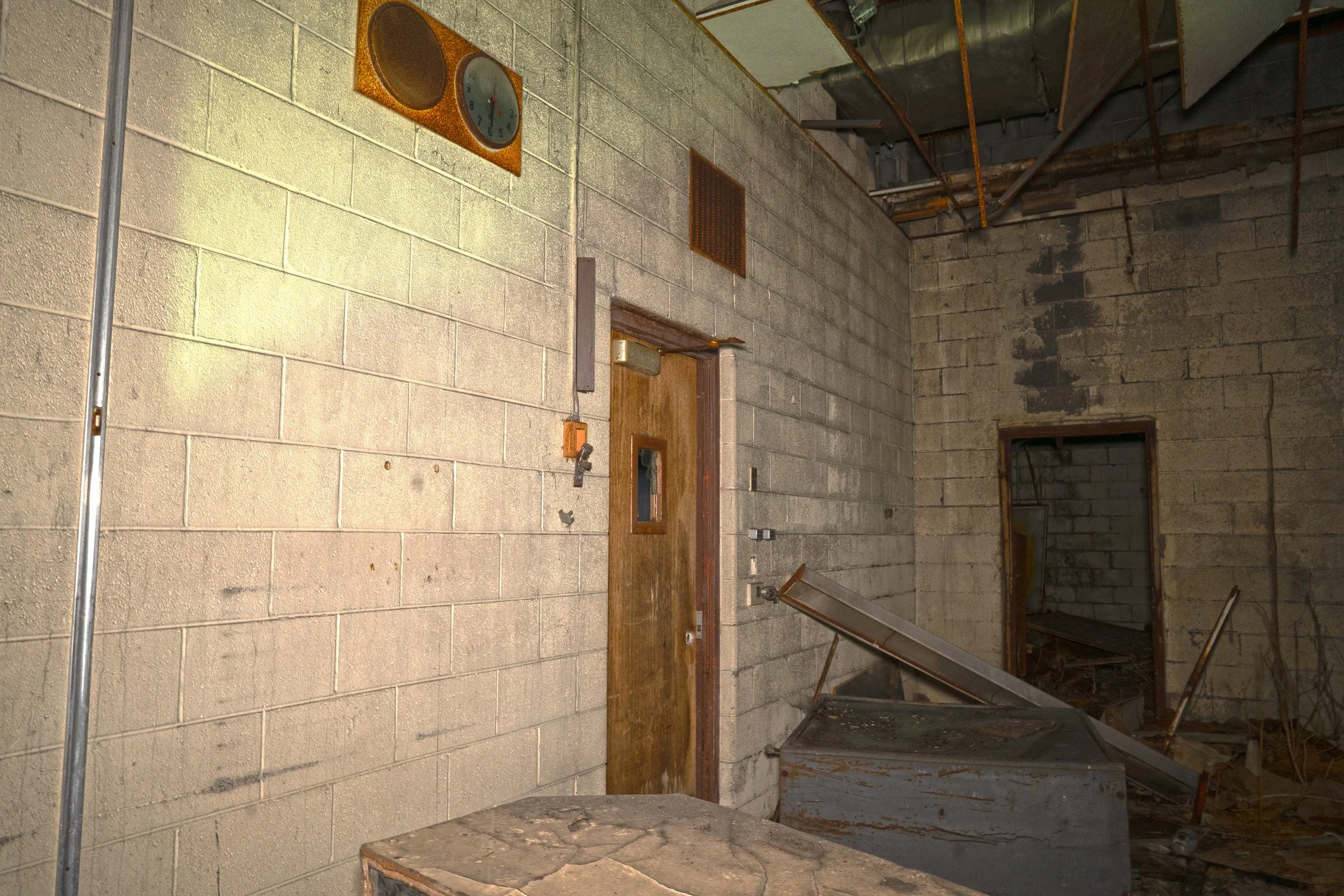 Kitchen room a clock remains intact on the wall
