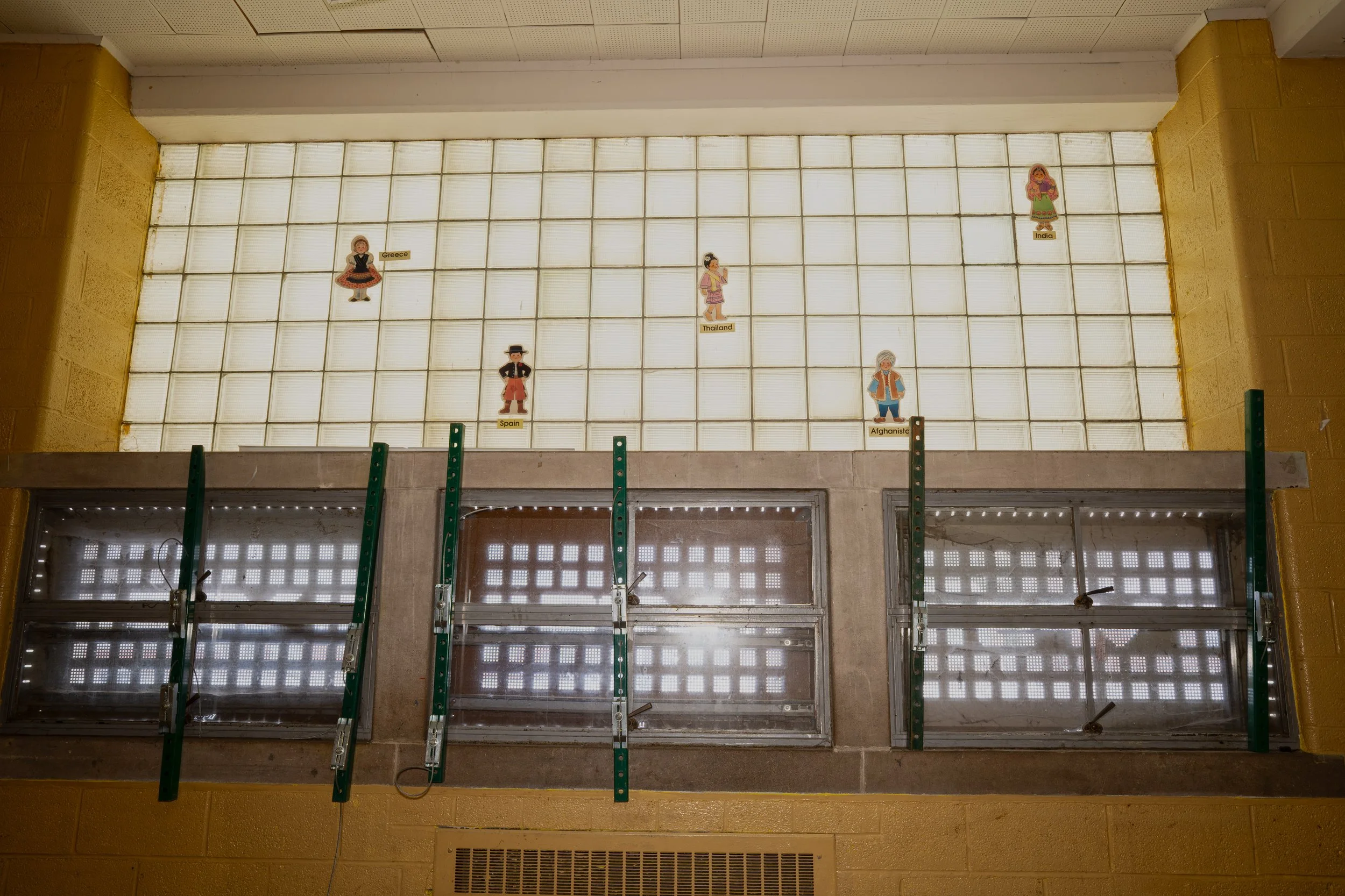 On the window of the same classroom figures depicting cultures from around the world 