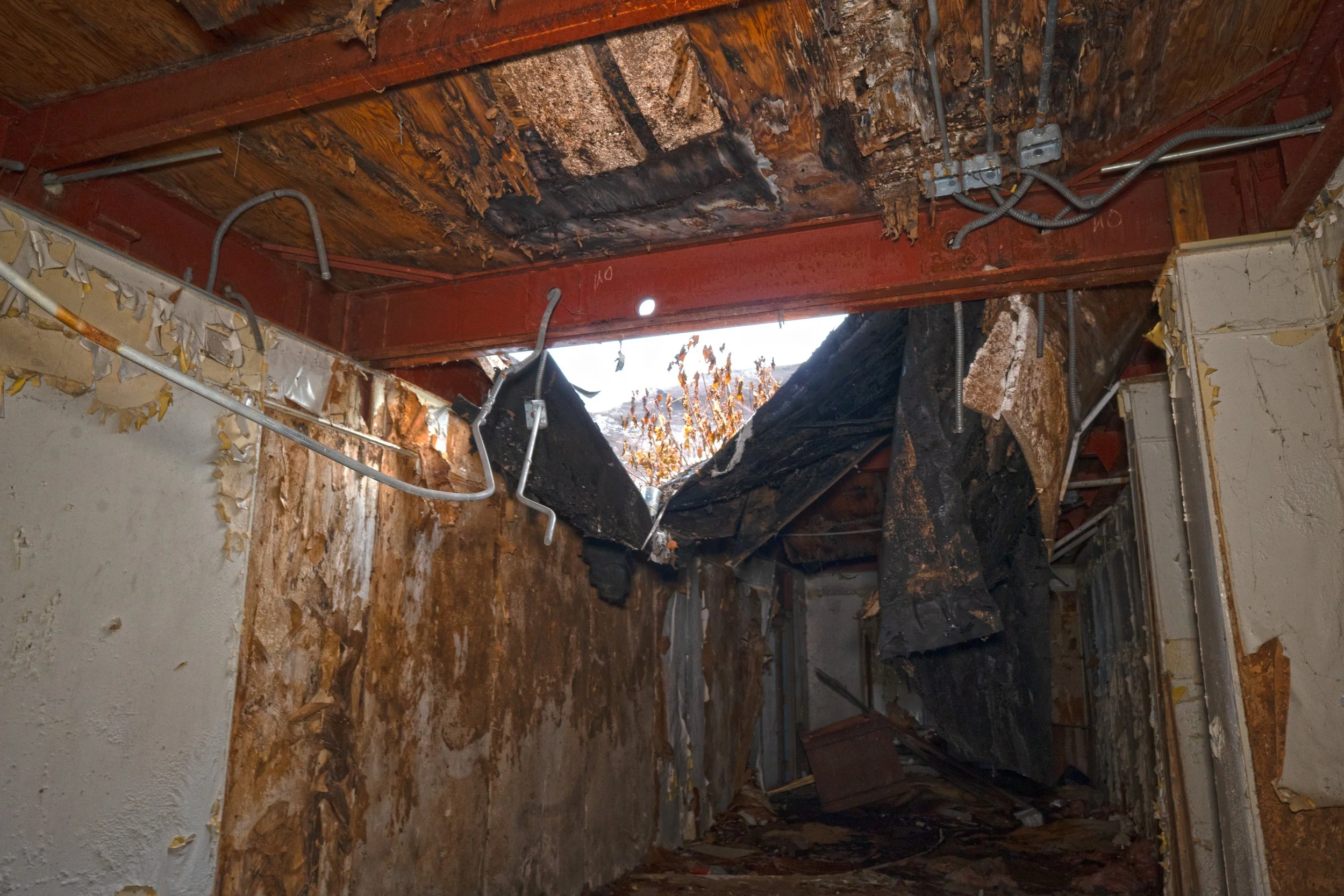Part of the ceiling has began to collapse in a hallway 