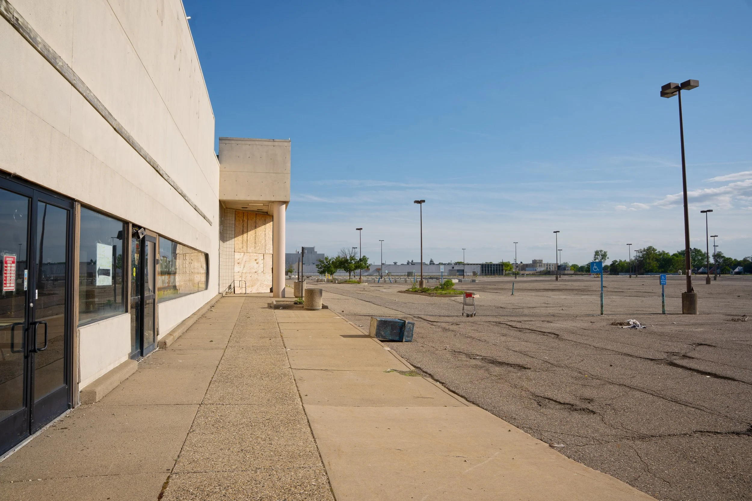 The parking lot is a wasteland of cement blocks to prevent cars from parking inside
