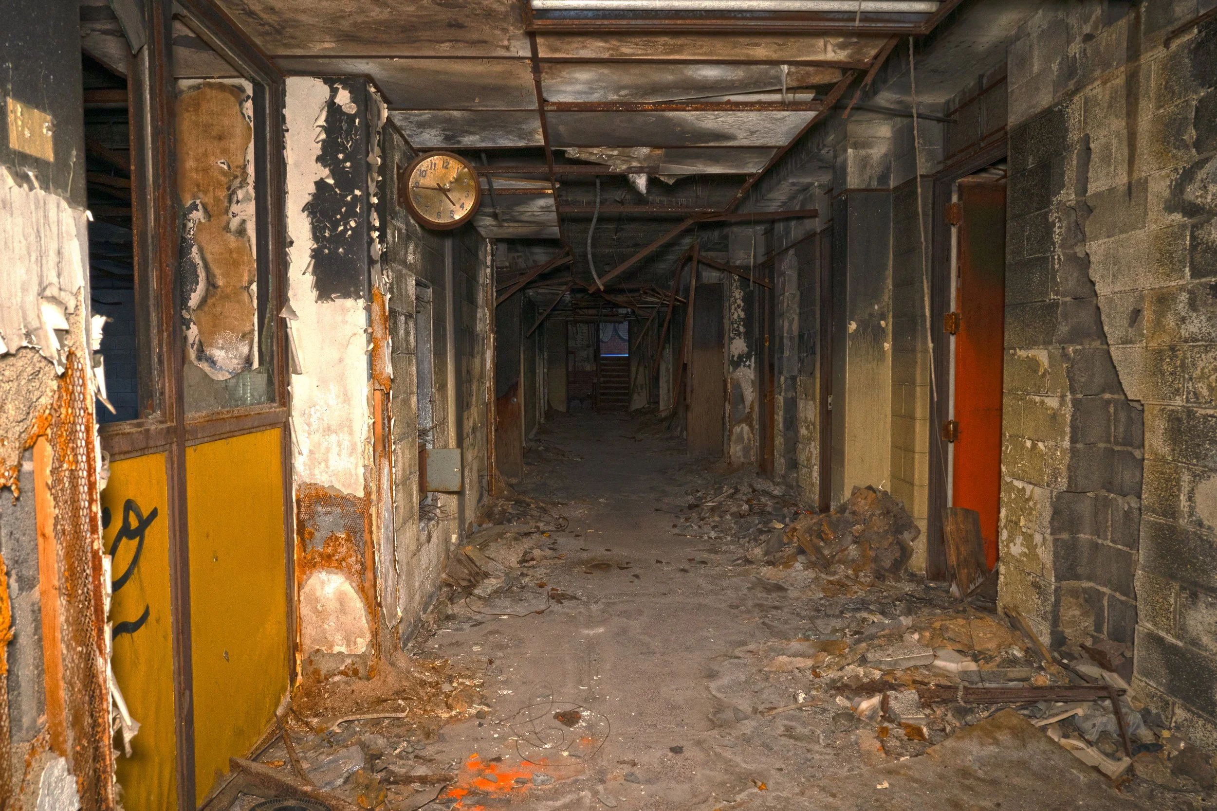 The 2nd floor classroom is a oldball, while a fire has clearly sweep the corridor a lone clock remains intact almost perfectly  