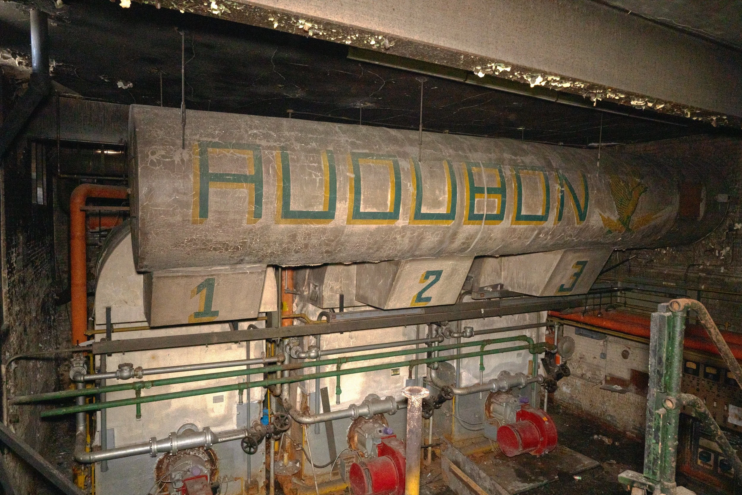 A boiler in the basement that hosts the name of the school on it