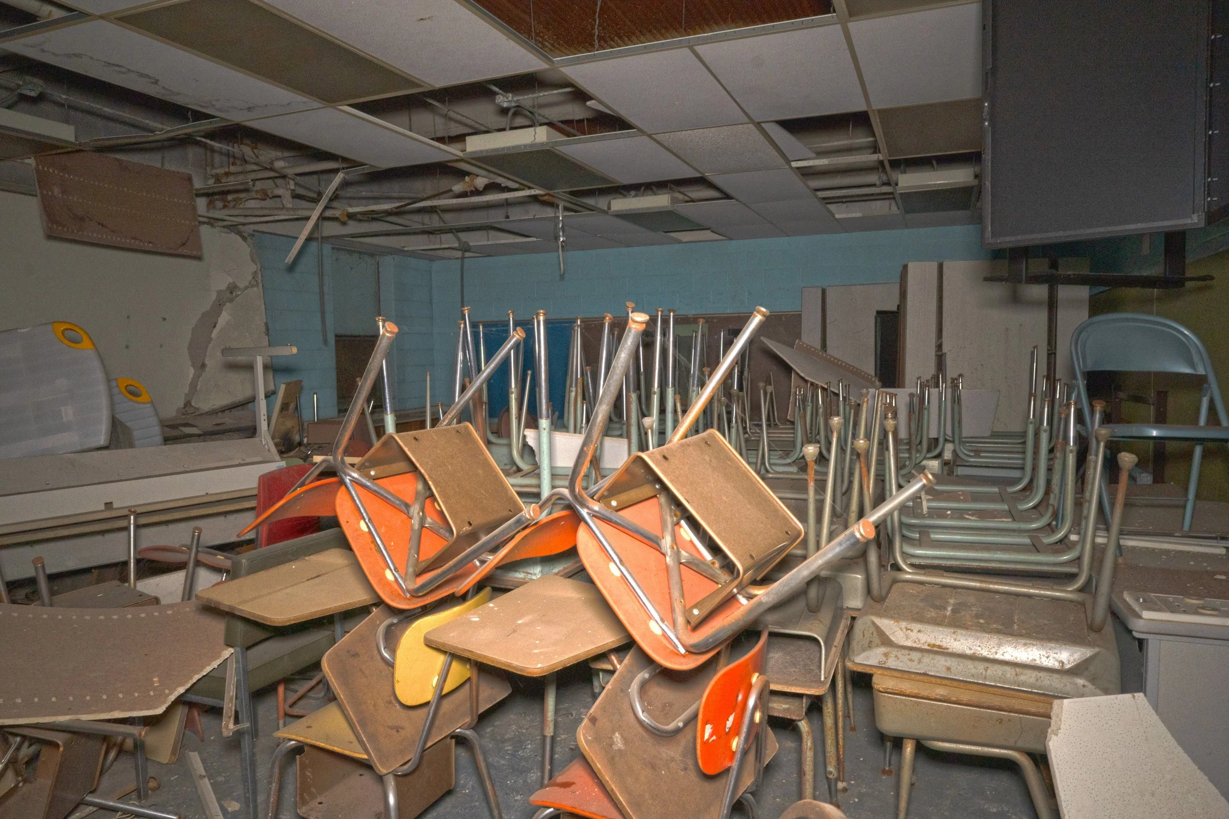 A 1st floor classroom with all the desks and chairs stacked up