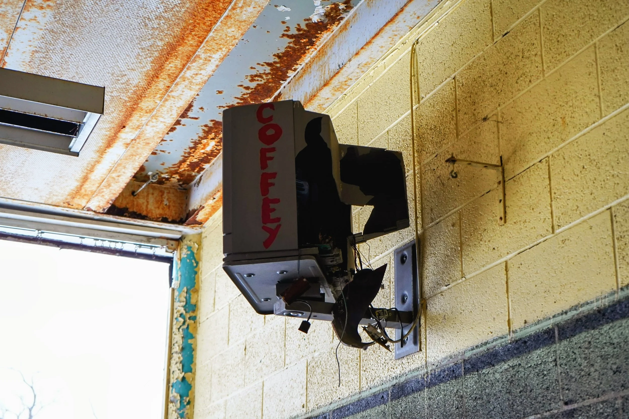 On the side of the TV the name of the school "Coffey" is present likely put on the side of the TV during the schools operation