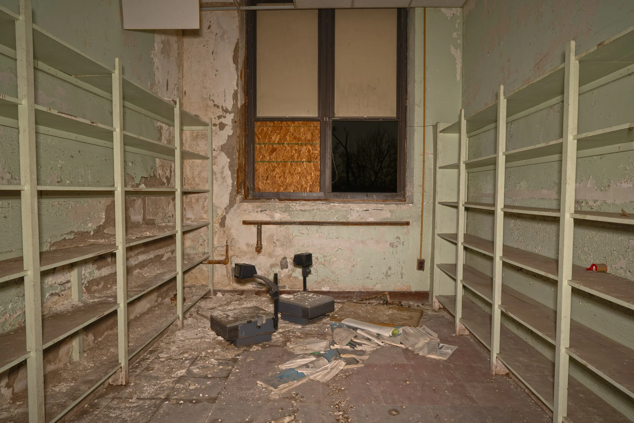 Two additional 2000s era projectors in a storage room on the 2nd floor