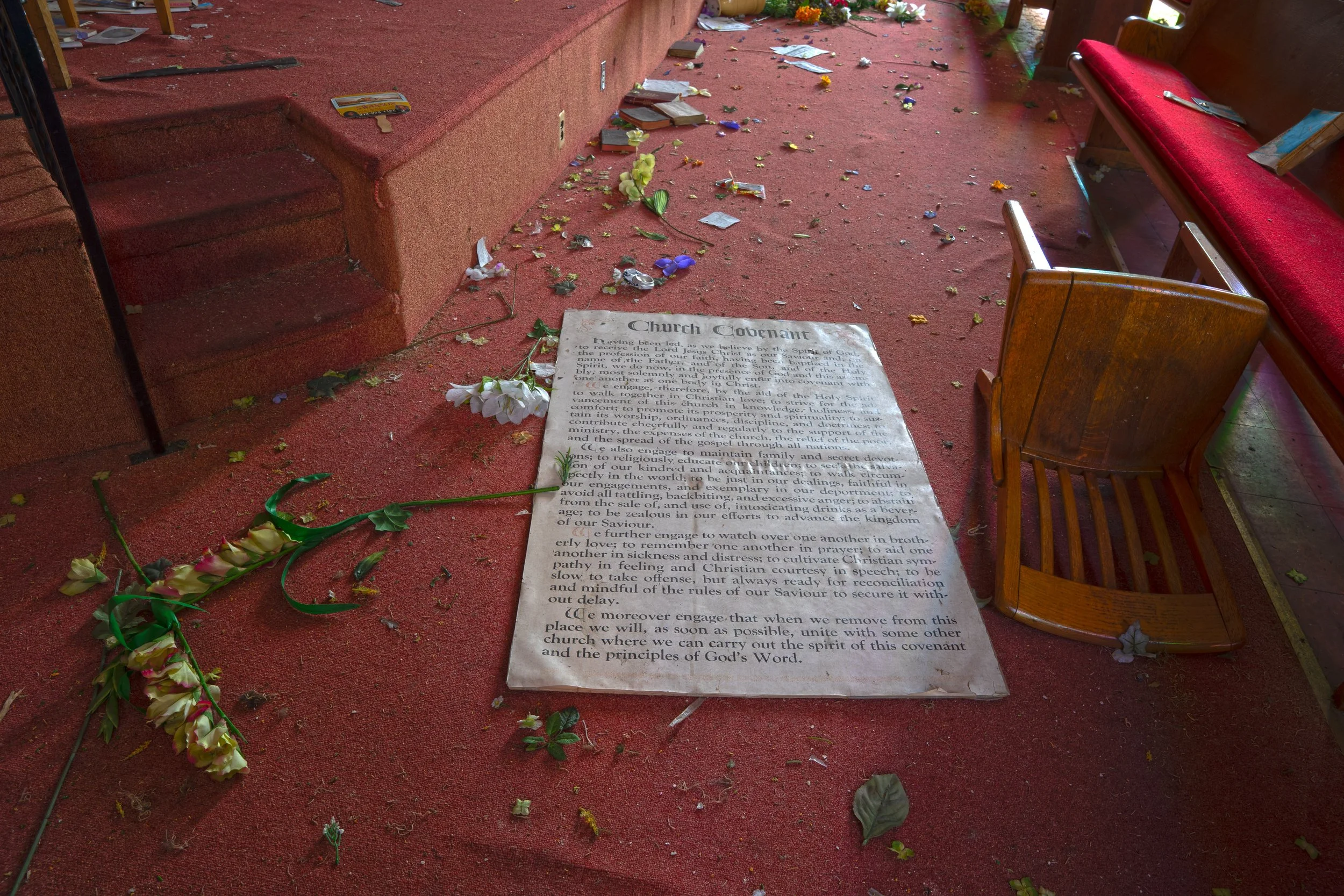 Church mission poster on floor next to altar