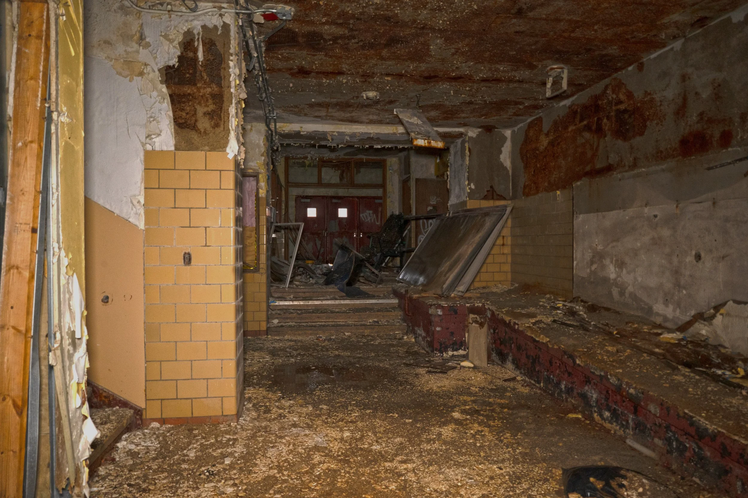 1st floor hallway next to Gymnasium and next to one of the main entrances 