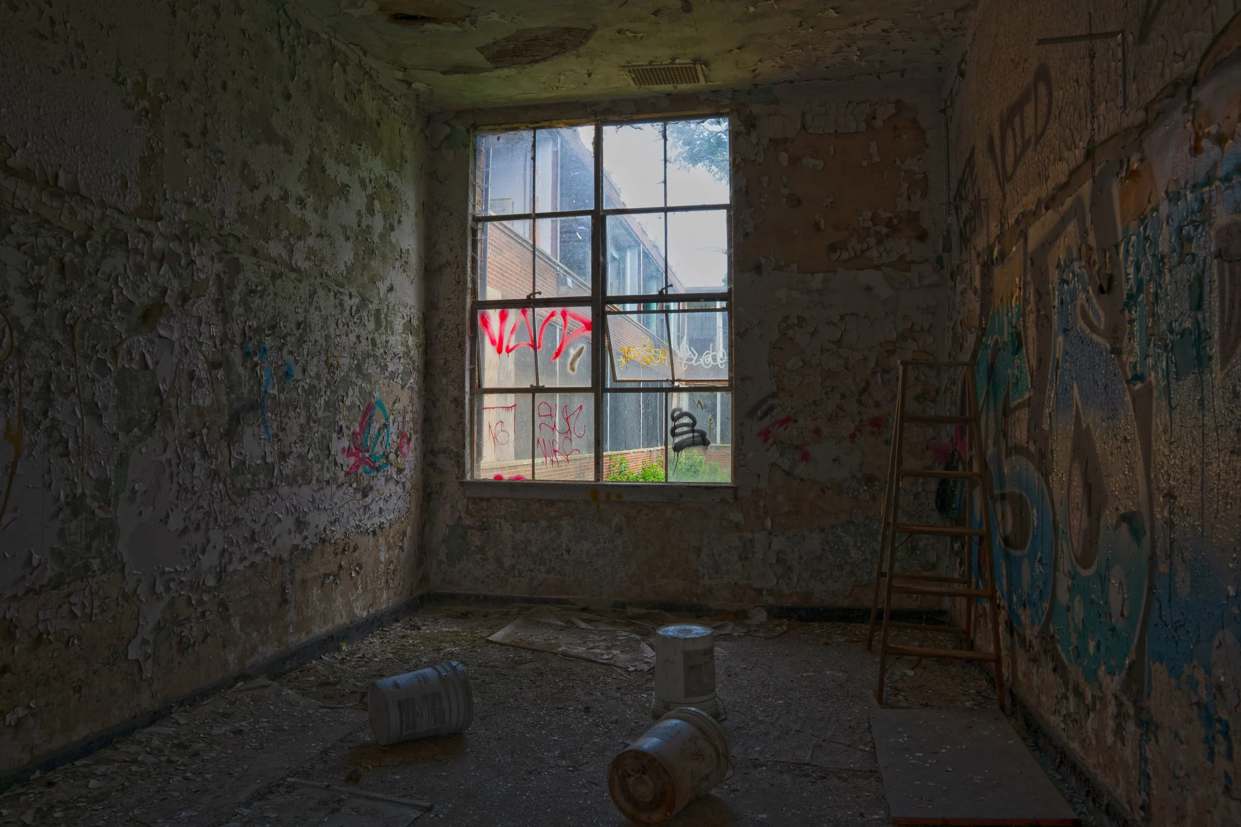 Storage room in the 1925 building with a window allowing view of the 1954 addition