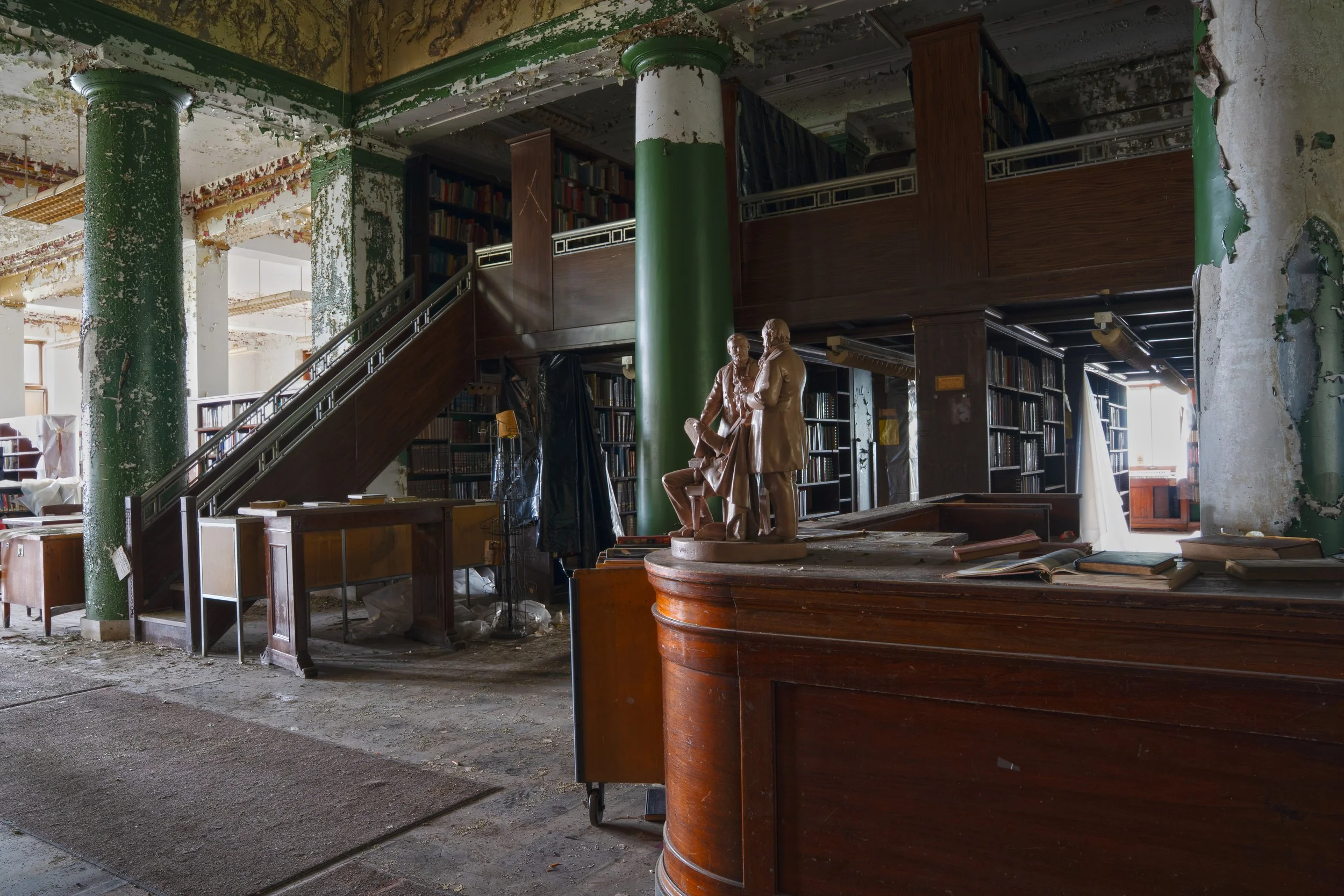 Main desk with rows of books behind the desk