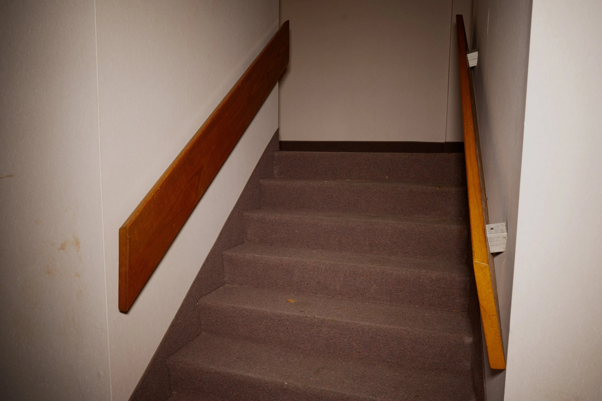 Staircase leading down from auditorium to main hallway