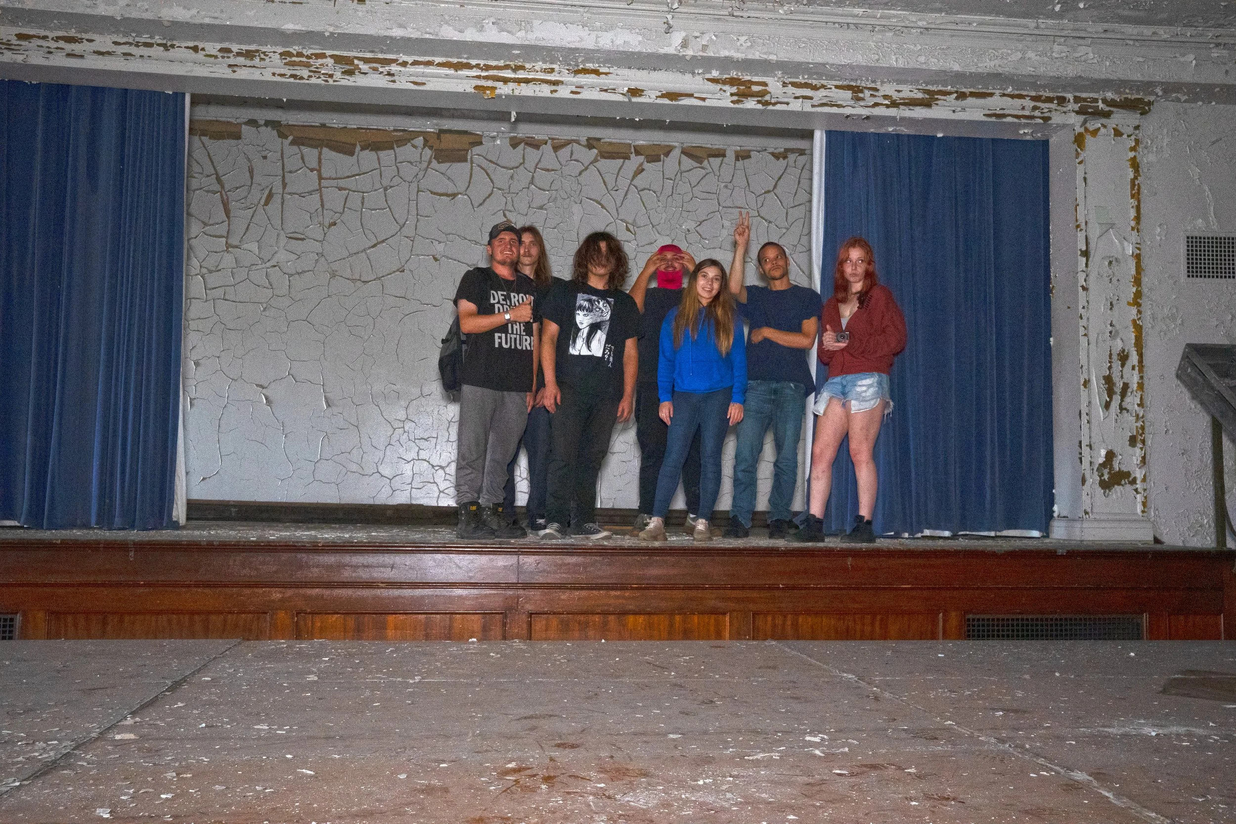 A group photo of some of the major production crew of abandonedcommercialdetroit along with some fans that met us along the way on this night on the stage of the auditorium 