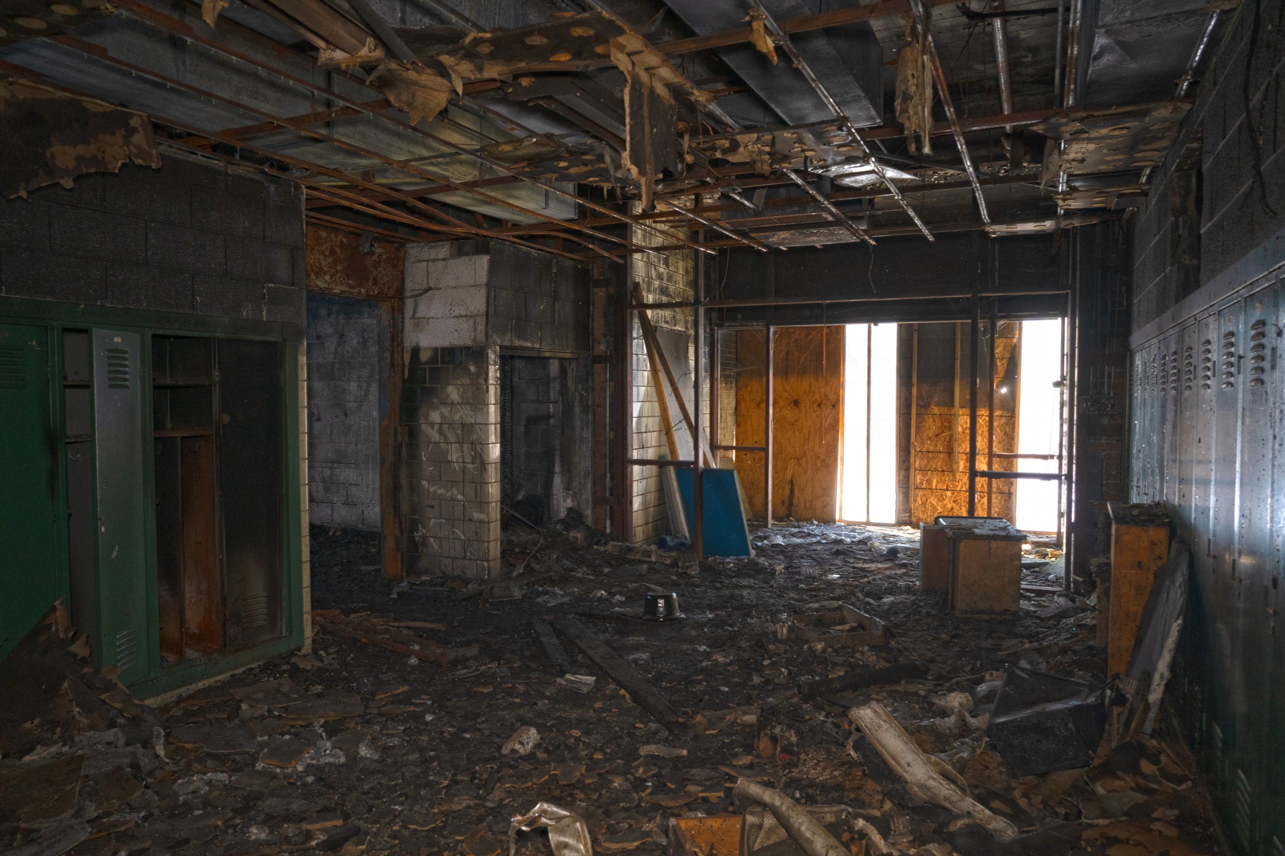 Fire damage has caused much of the classroom corridor to decay