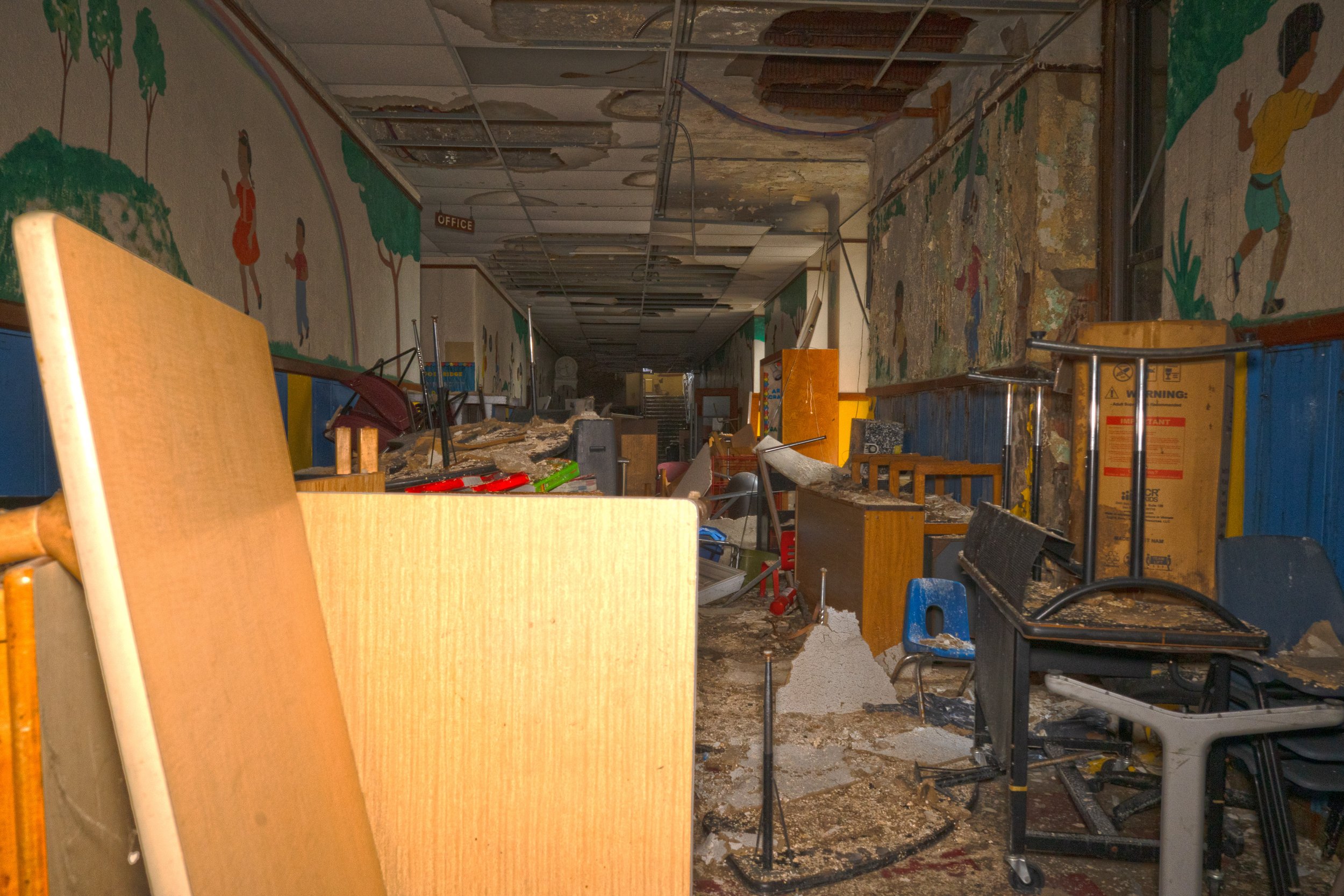 Most sections of the 1st floor hallway remain cluttered  