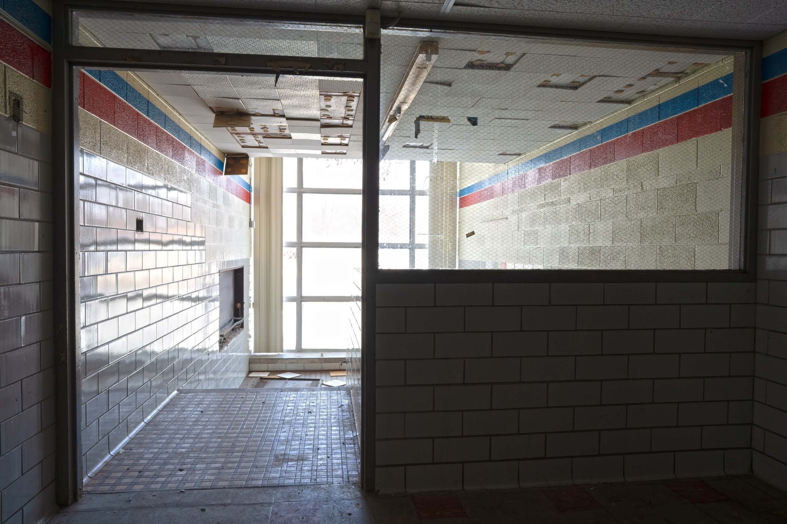 2nd floor staircase with hallway behind the camera