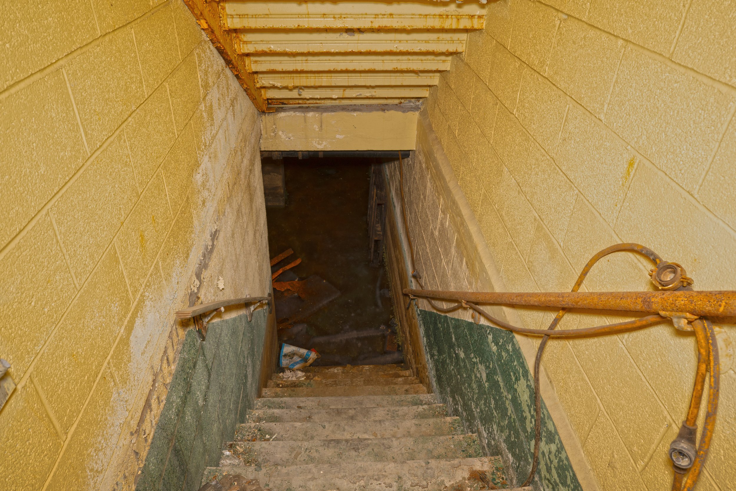Stairs leading to the flooded basement (Above you can see the frame for the 2nd floor staircase)