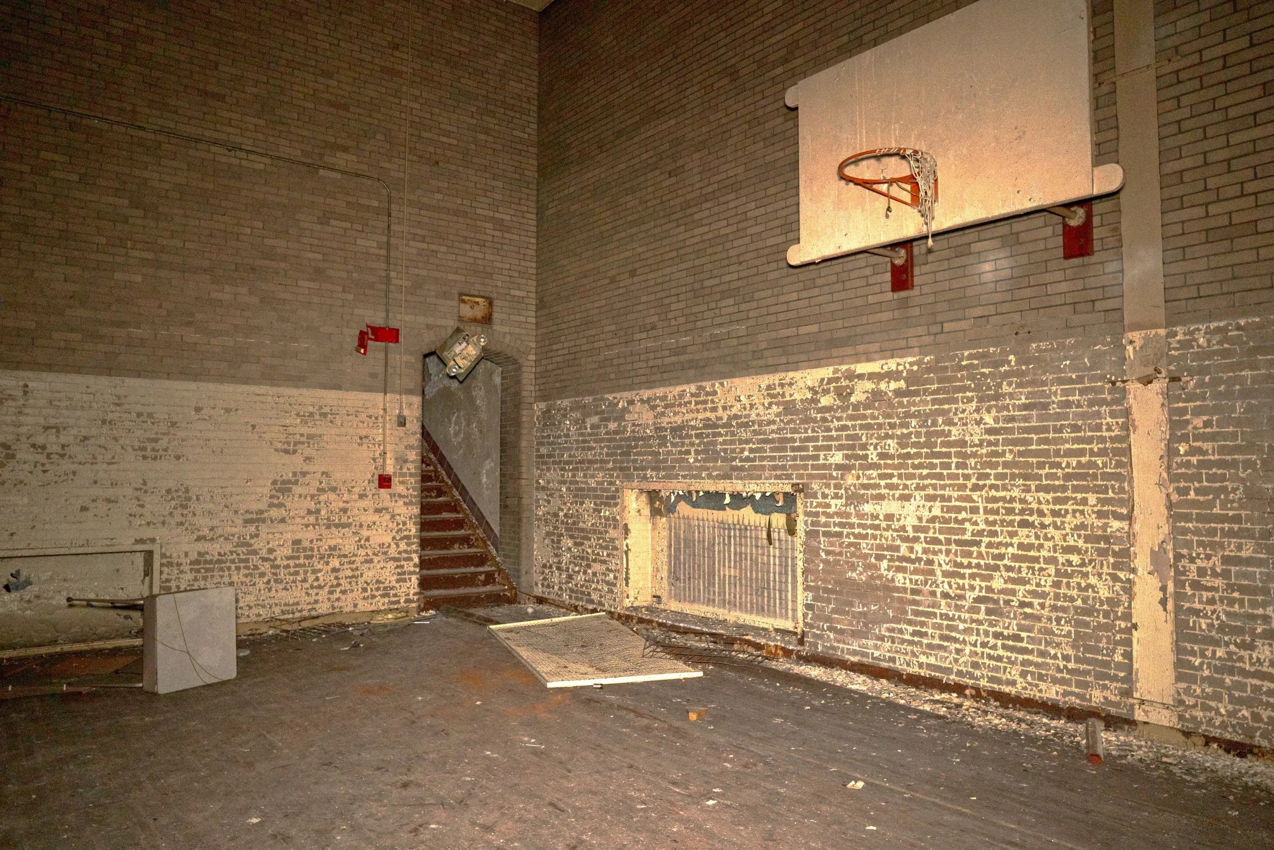 Both gyms are accessed via separate stairs leading down onto the gym floor