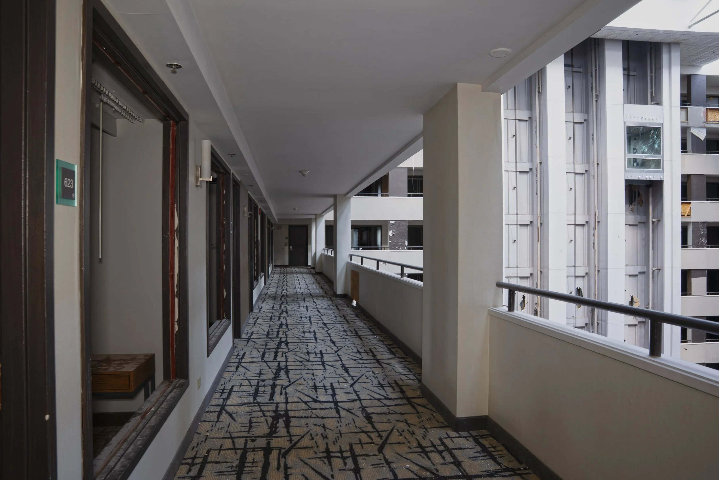 6th floor hallway with atrium on right