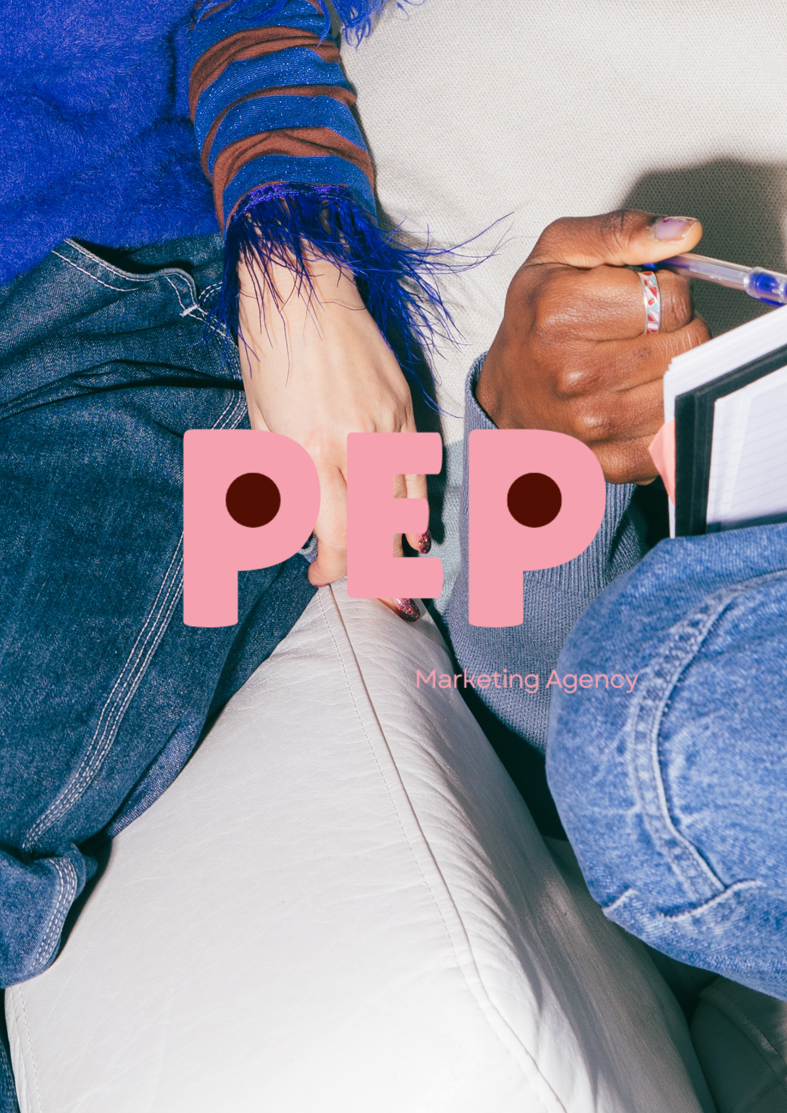 A person with painted fingernails and a ring on their finger is sitting on a white leather seat, holding a pen and notebooks. They are wearing a blue and brown striped long-sleeve shirt and a blue fuzzy sweater. The overlay text reads 'PEP Marketing