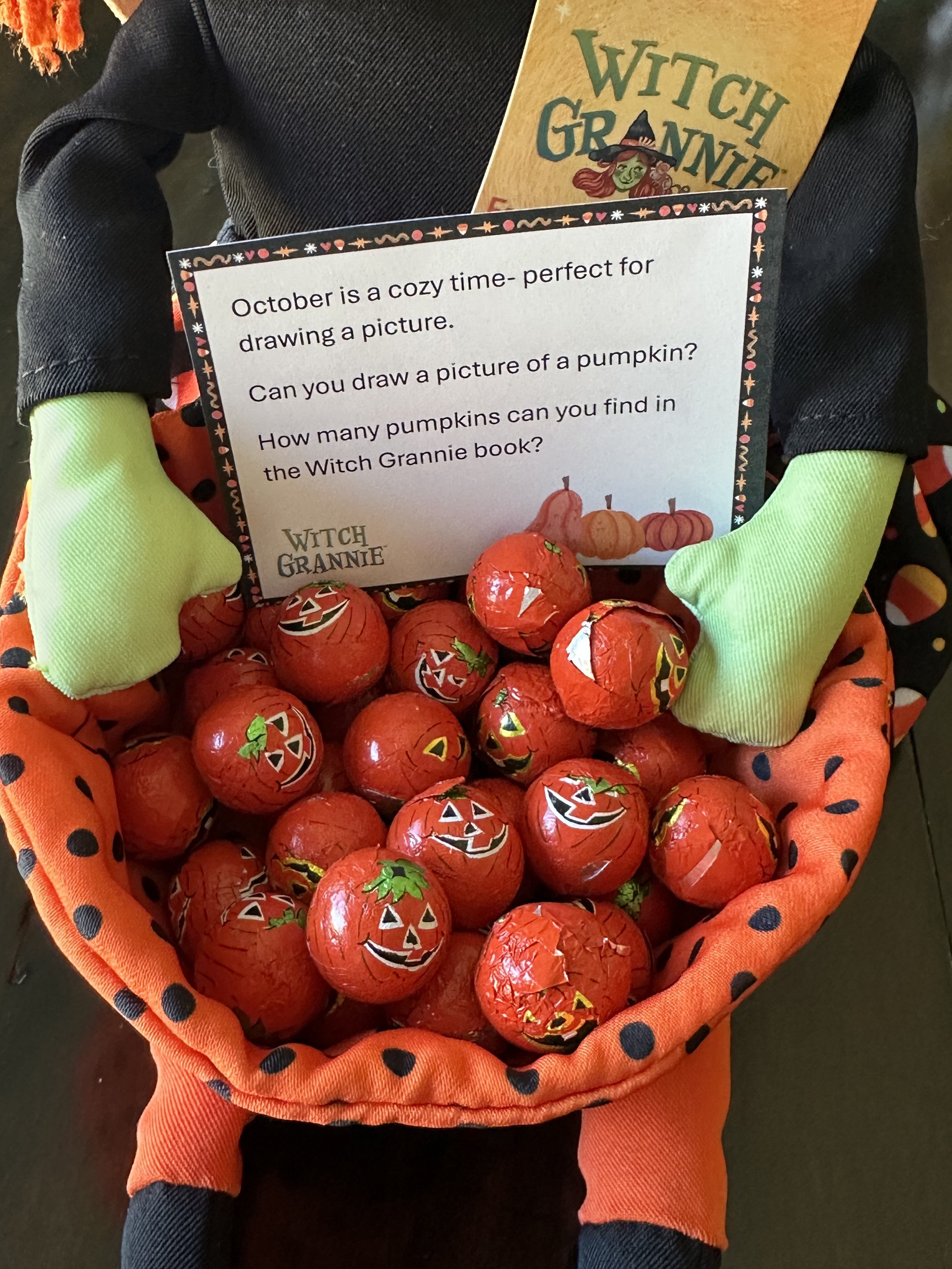 foil wrapped pumpkins in basket shop.jpeg