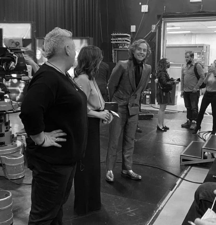 Julia Wilson backstage with comedian Darren Hayes, sharing a lighthearted moment before a live comedy show