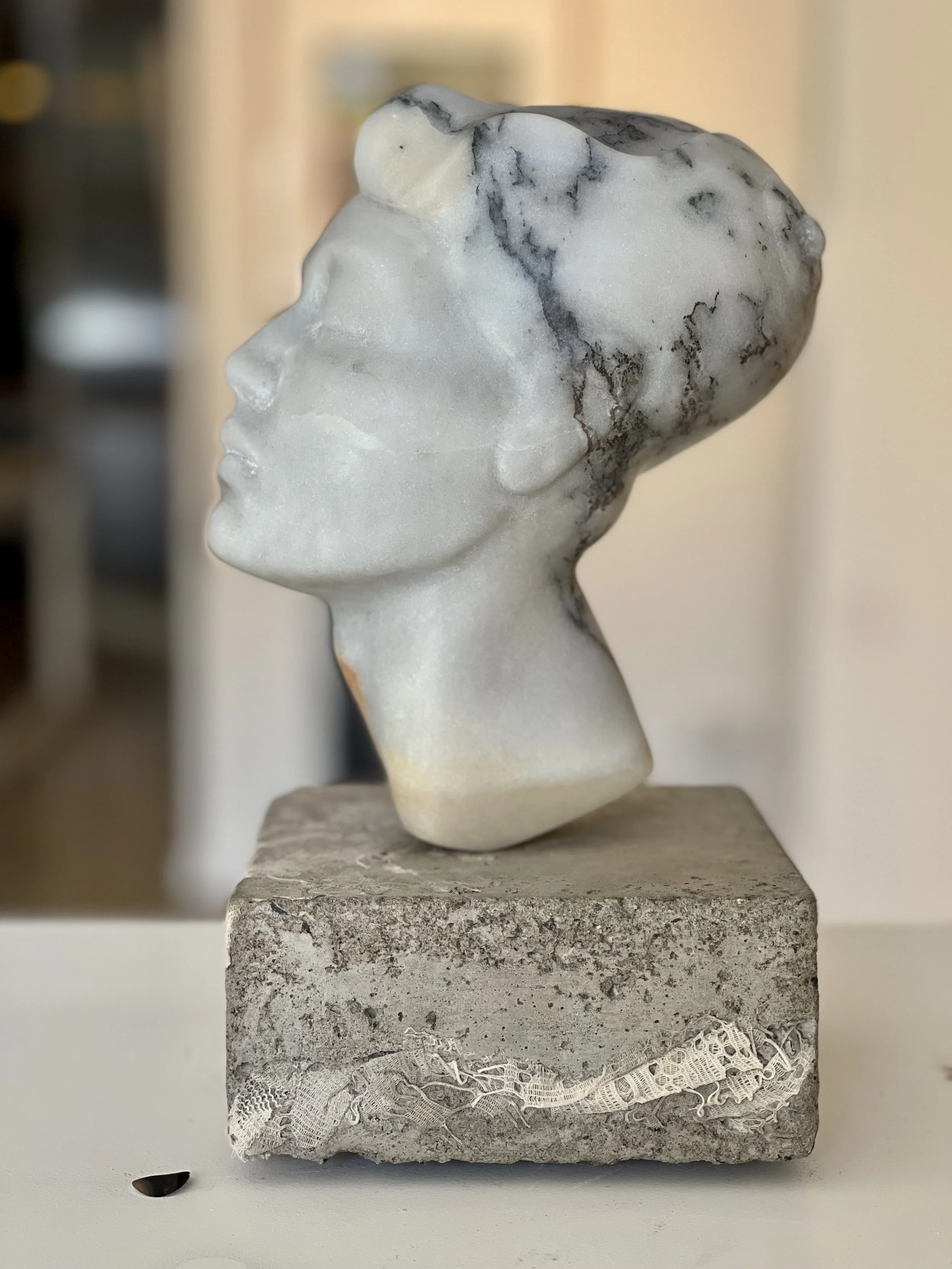 Paonazzo Carrara marble on concrete with vintage lace