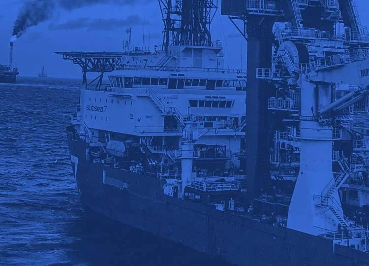A large offshore drilling platform or oil rig in the ocean.