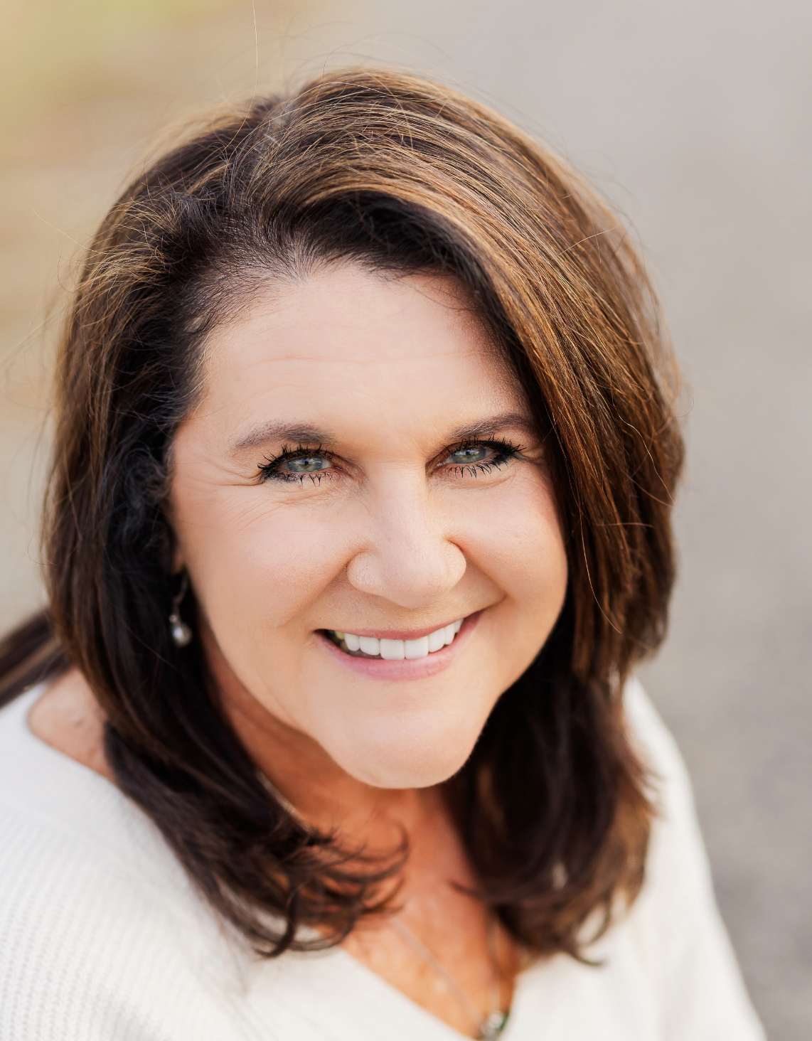 Headshot of Kara Bloomfield of 501 Professionals Realty & Investments, who endorses Loux Creative & Communication