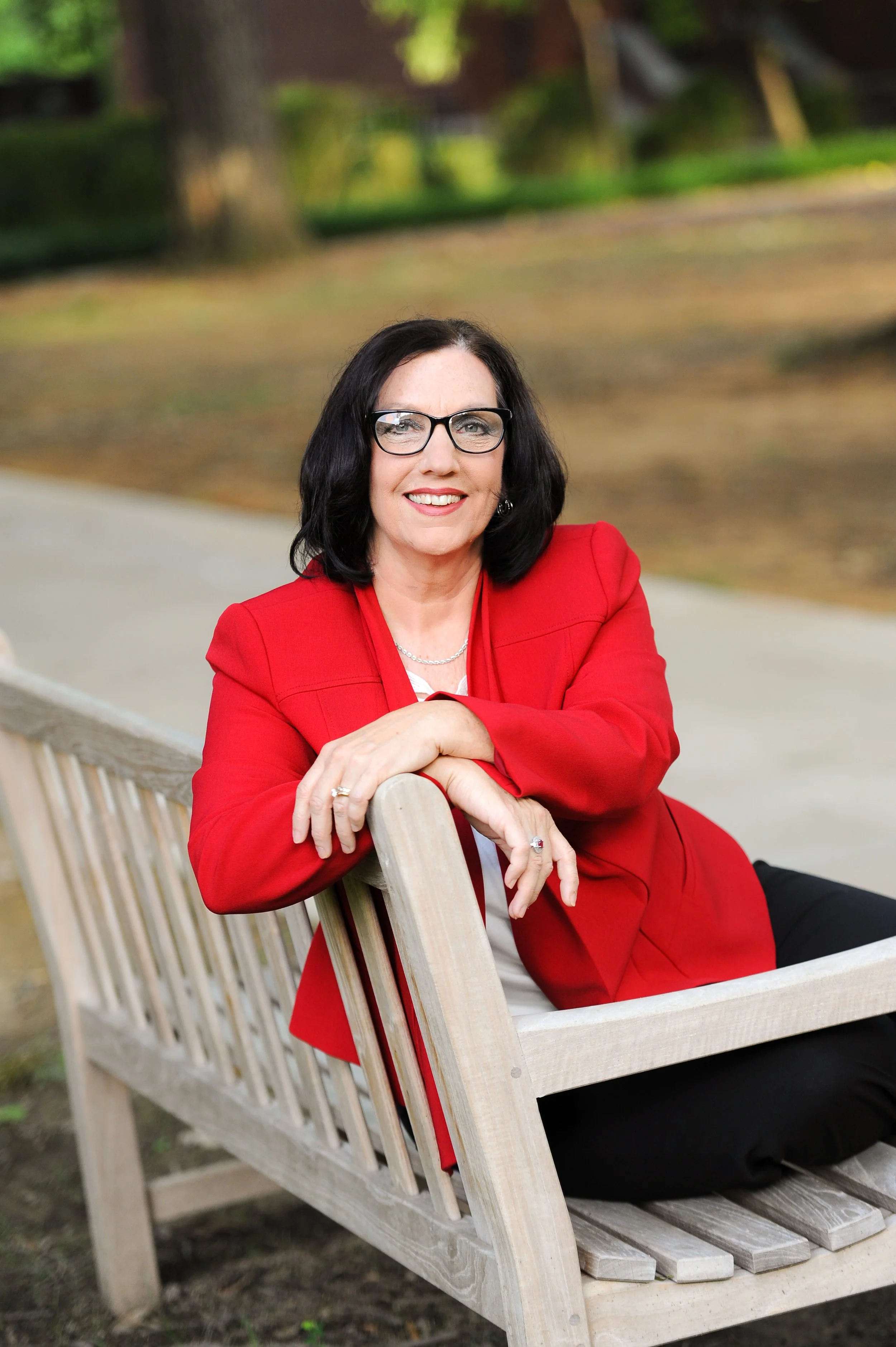 Headshot of Cathy Lee, owner of Cathy Lee Coaching, who is a client of Loux Creative & Communication