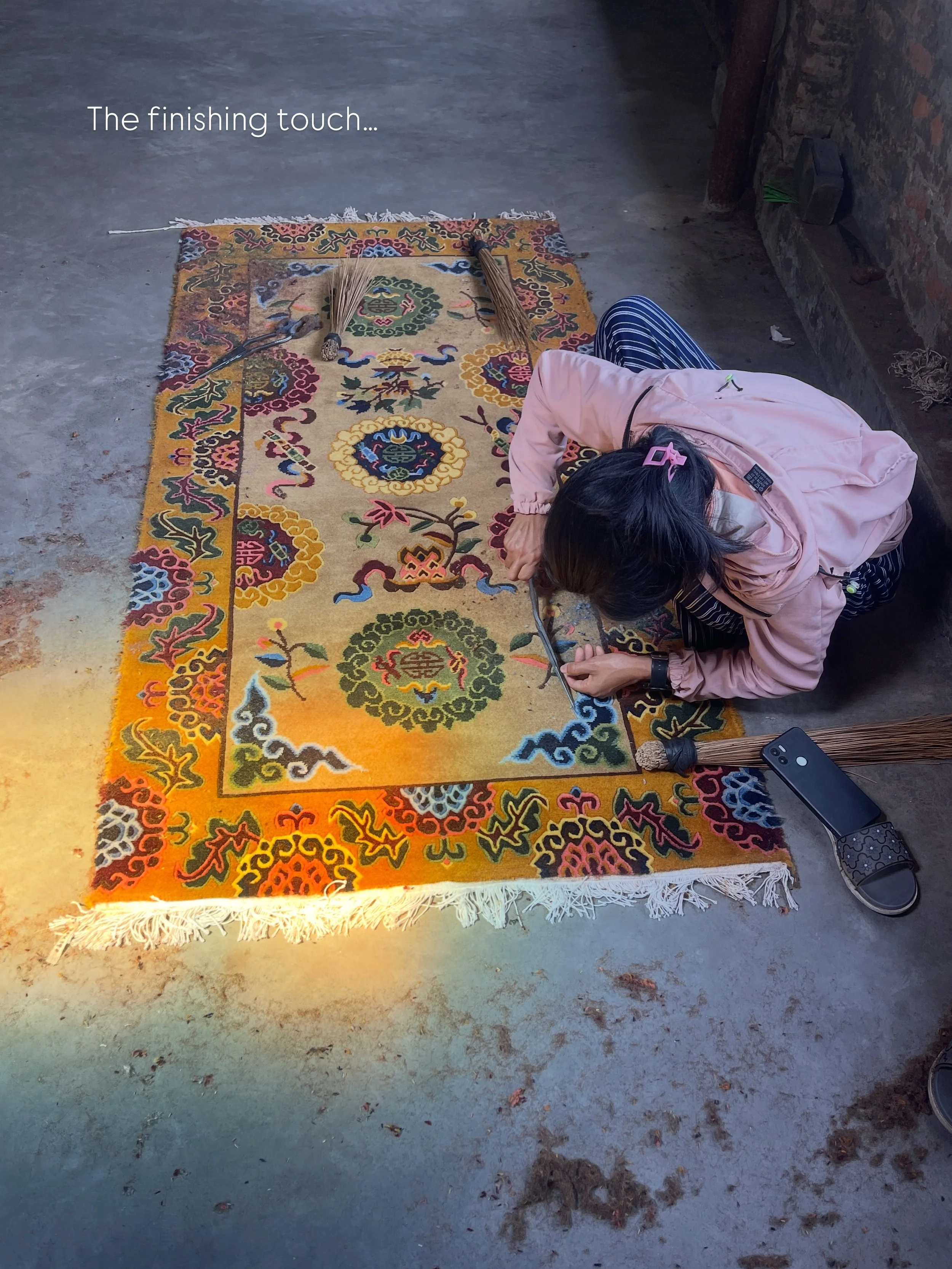 The finishing touch ~

After months of weaving, each rug is carefully trimmed by hand to create an even pile, sharpen motifs, and reveal the clarity of the design. 

Working with scissors, artisans sculpt the surface section by section, bringing defi