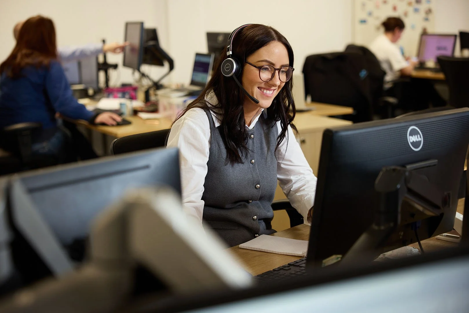 Client Team Assistant talking on the phone to a client