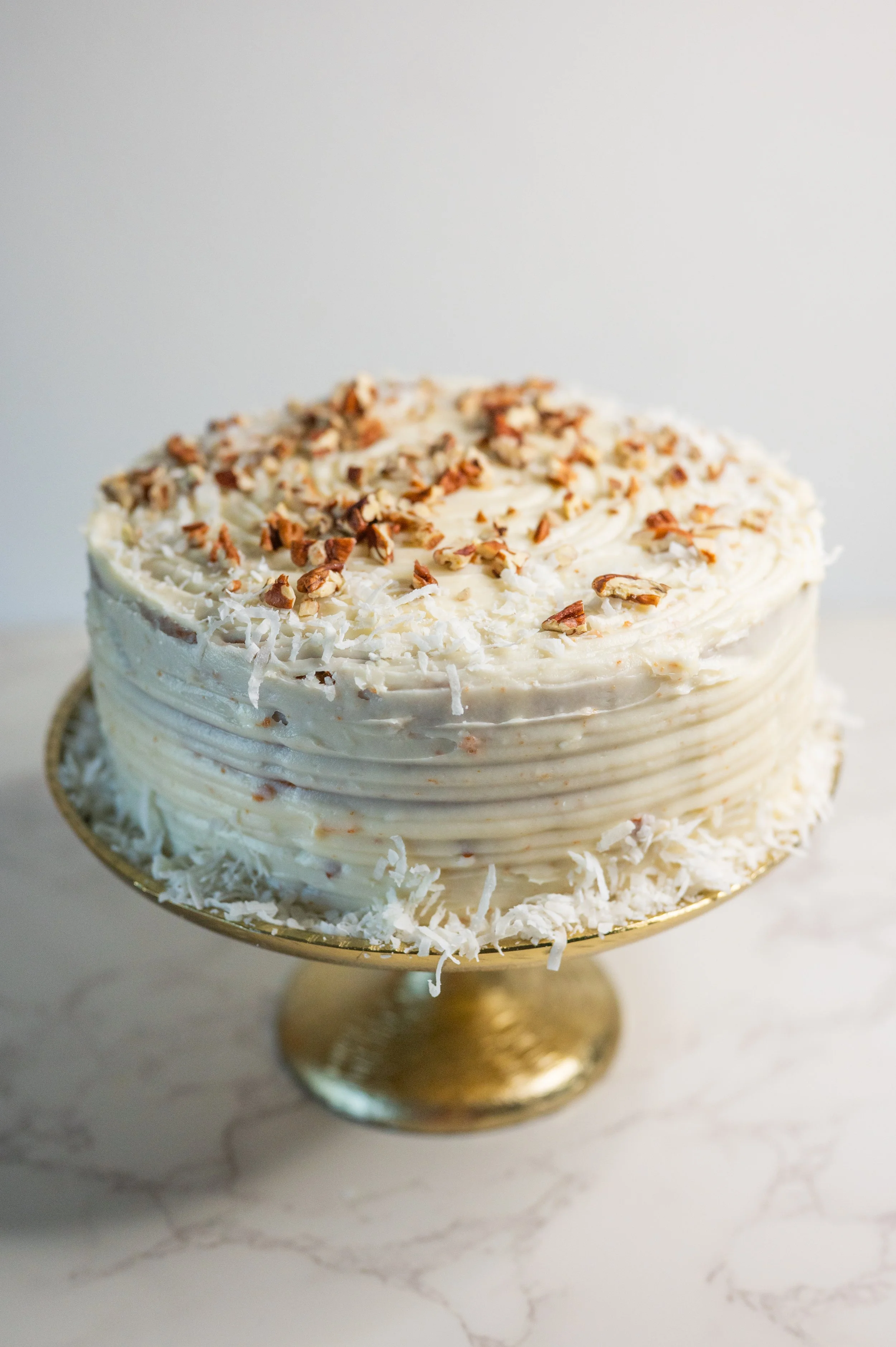 Close-up of fluffy cake crumb and smooth cream cheese frosting.