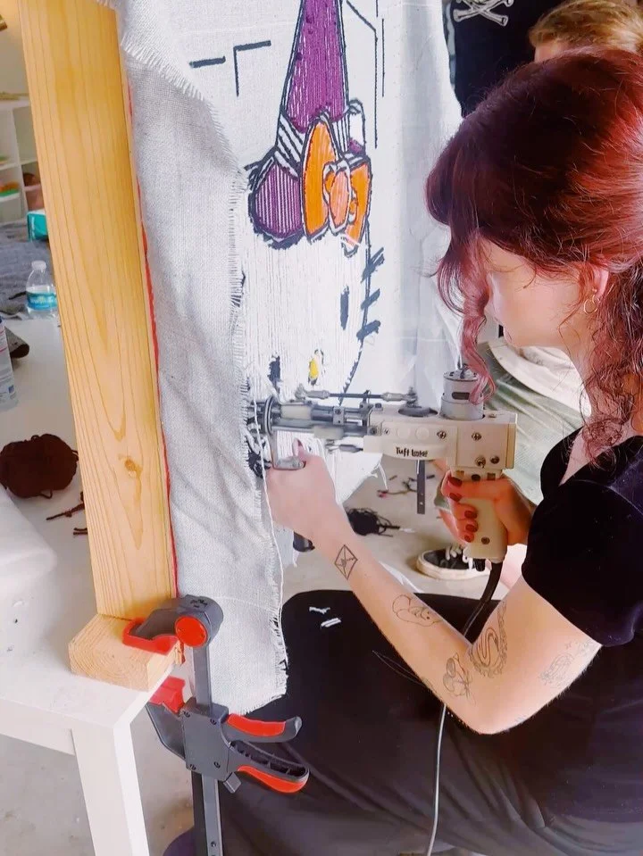 What an amazing I Love Yarn Day! 💜🧶 
Huge congrats to all of our first-time rug tufters who totally crushed it today. We had some adorable creations come to life, including some cute kitties, a Halloween Snoopy, and a perfectly spooky bat. 🐱🎃🦇 
