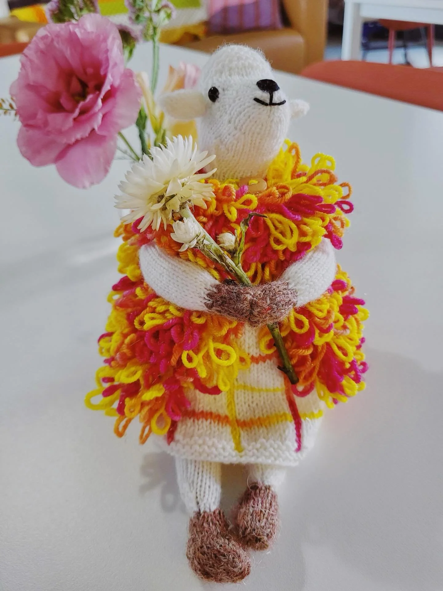 Ok waittttt what are we naming her 🥹🐑

Corky just finished knitting this tiny sheep queen and I get misty eyed every time I pick her up. The dress? The sparkly vest??? And like how can you not just love that little face? 
She&rsquo;s knit in our &l