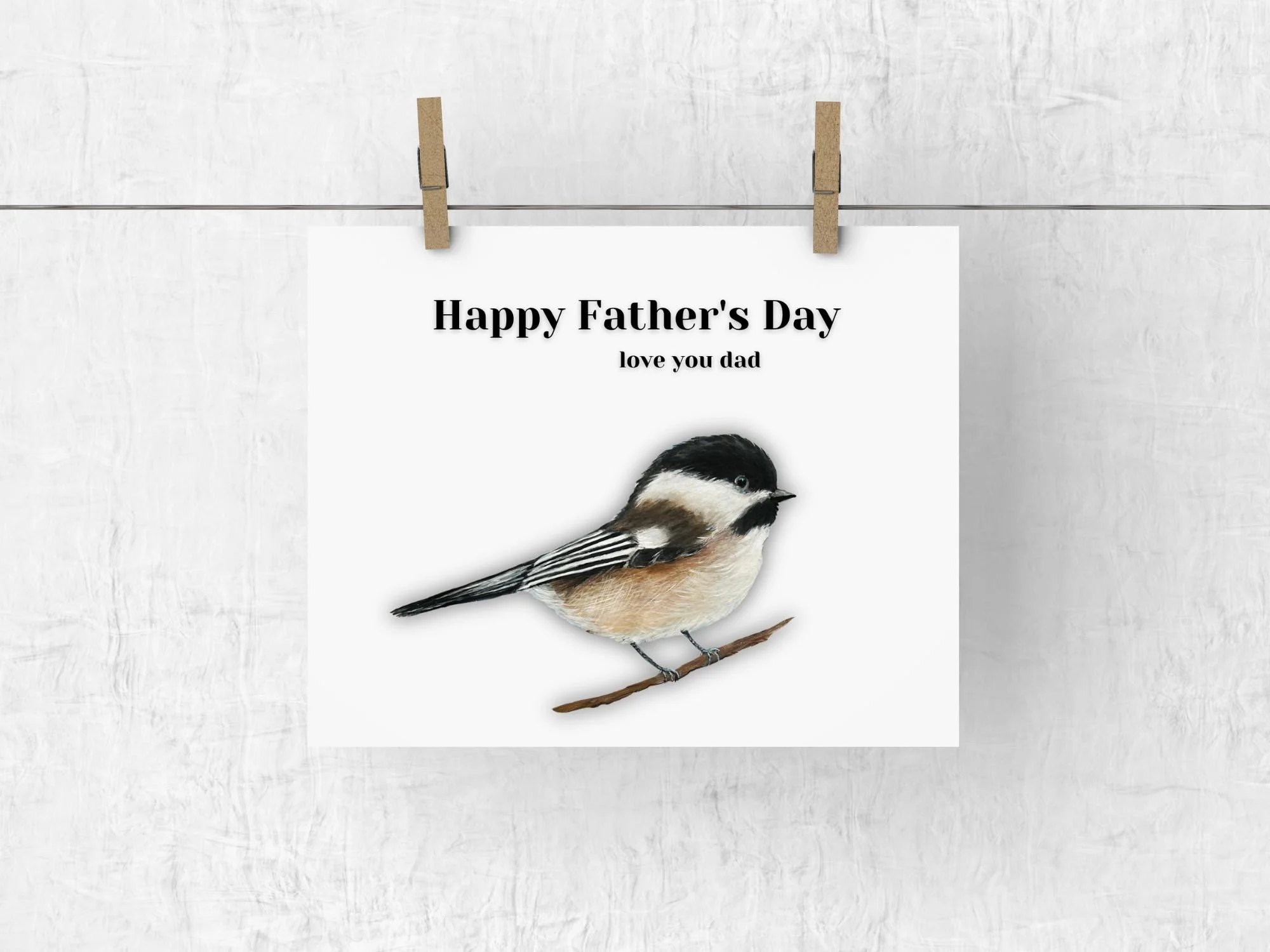 a father's day card with a black capped chickadee facing the right with Happy Fathers Day love you dad above it.  Its is a print of an acrylic painting by artist Maureen MacKenzie