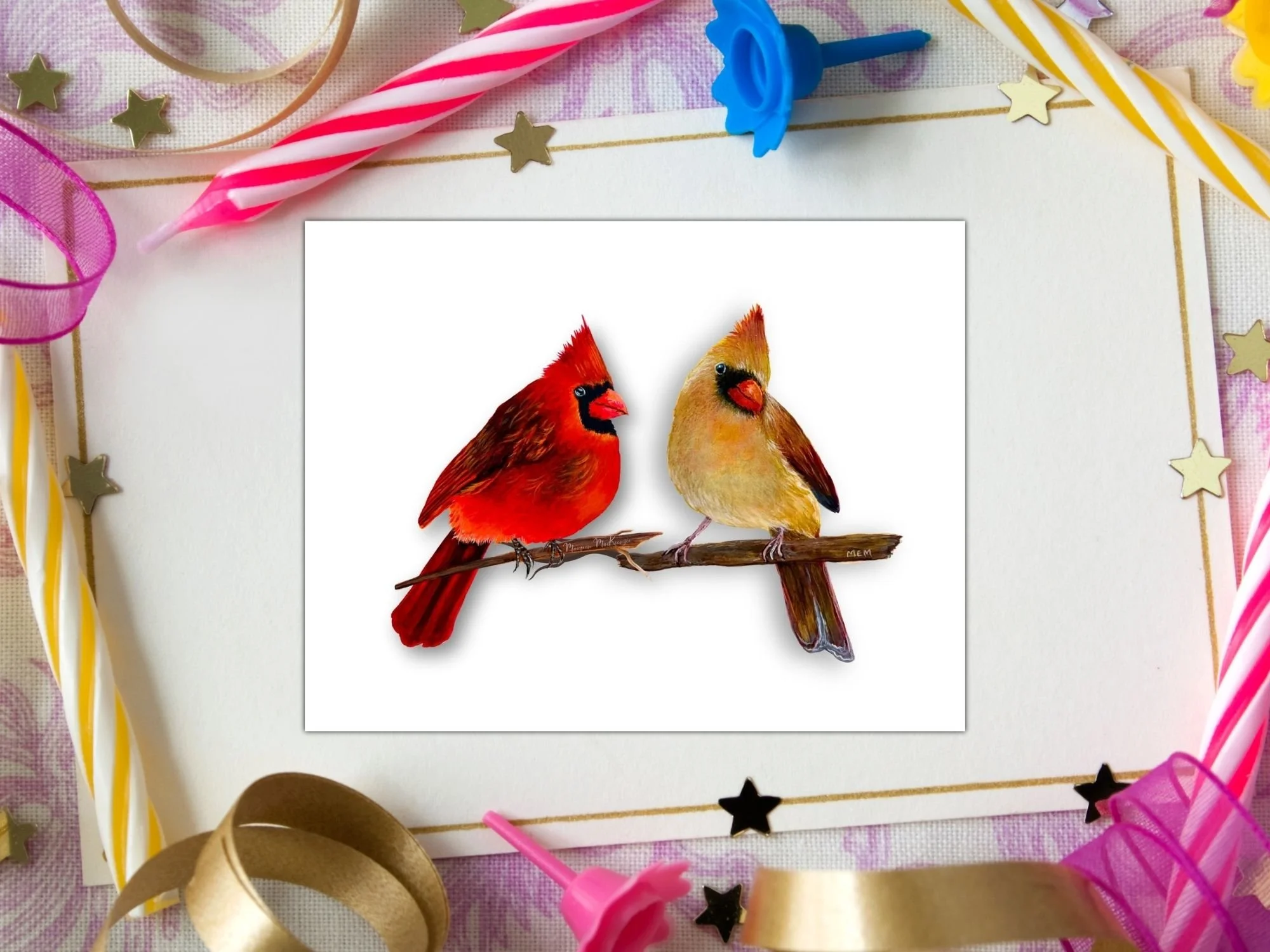 a greeting card of a male and female cardinal perched on a branch facing each other on a white background