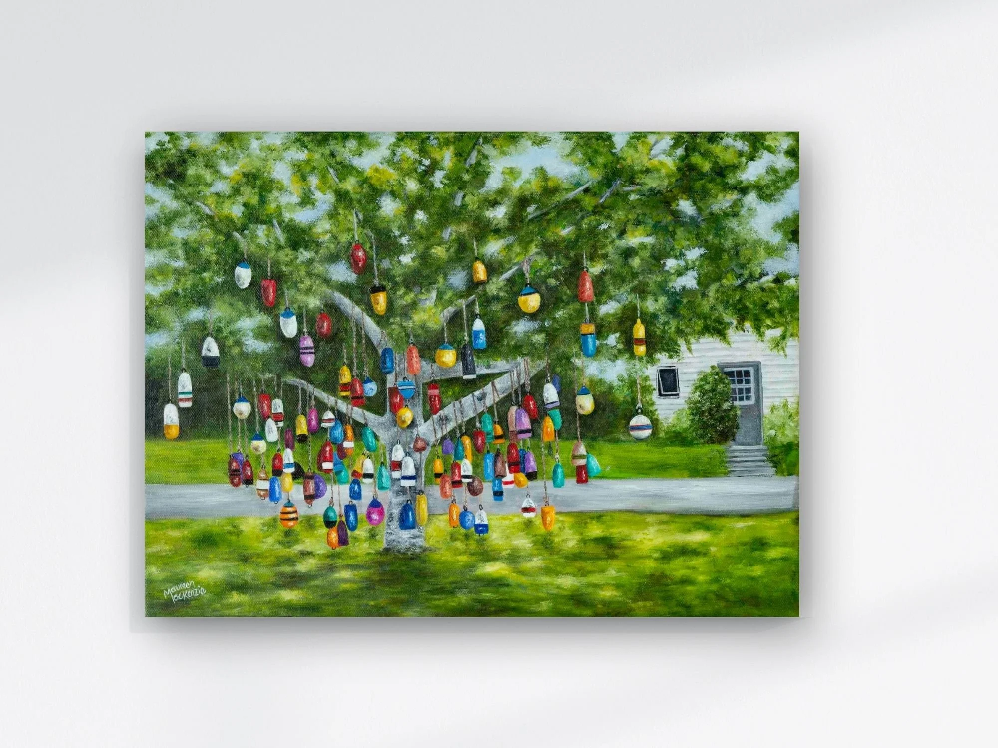 Original 12x16 oil painting of a colourful buoy tree in Prince Edward Island, featuring hanging fishing buoys beneath a leafy green tree in a coastal Maritime setting.