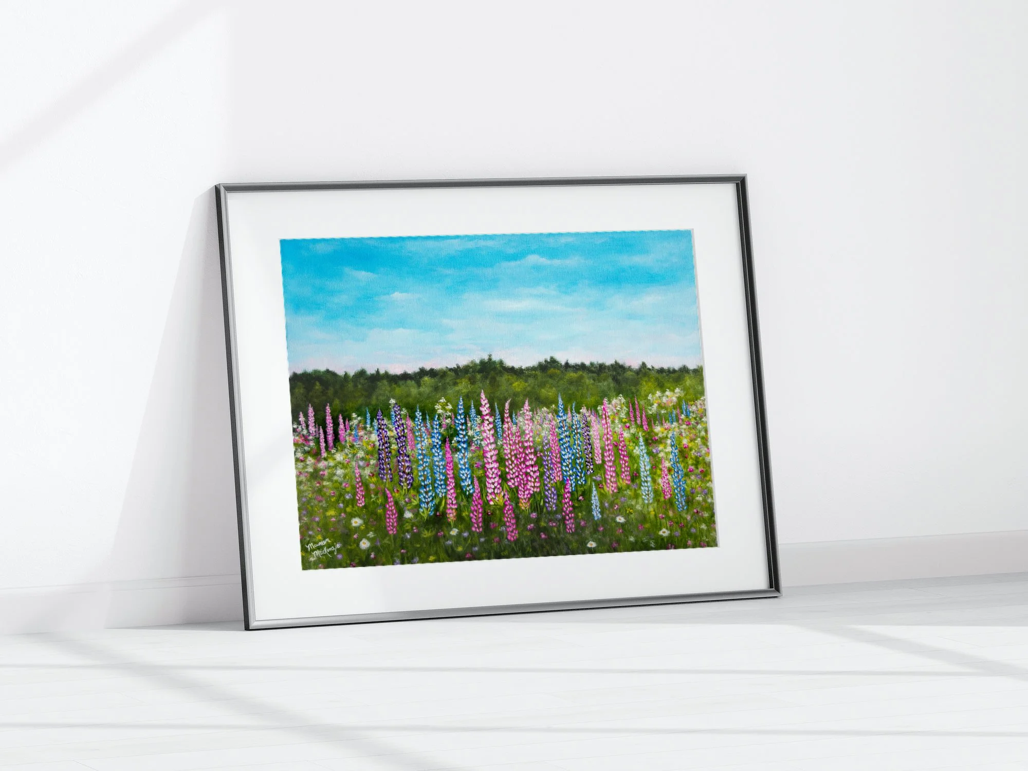 a framed print of a print of a colorful field of pink and purple lupines in bloom under a pale blue sky,