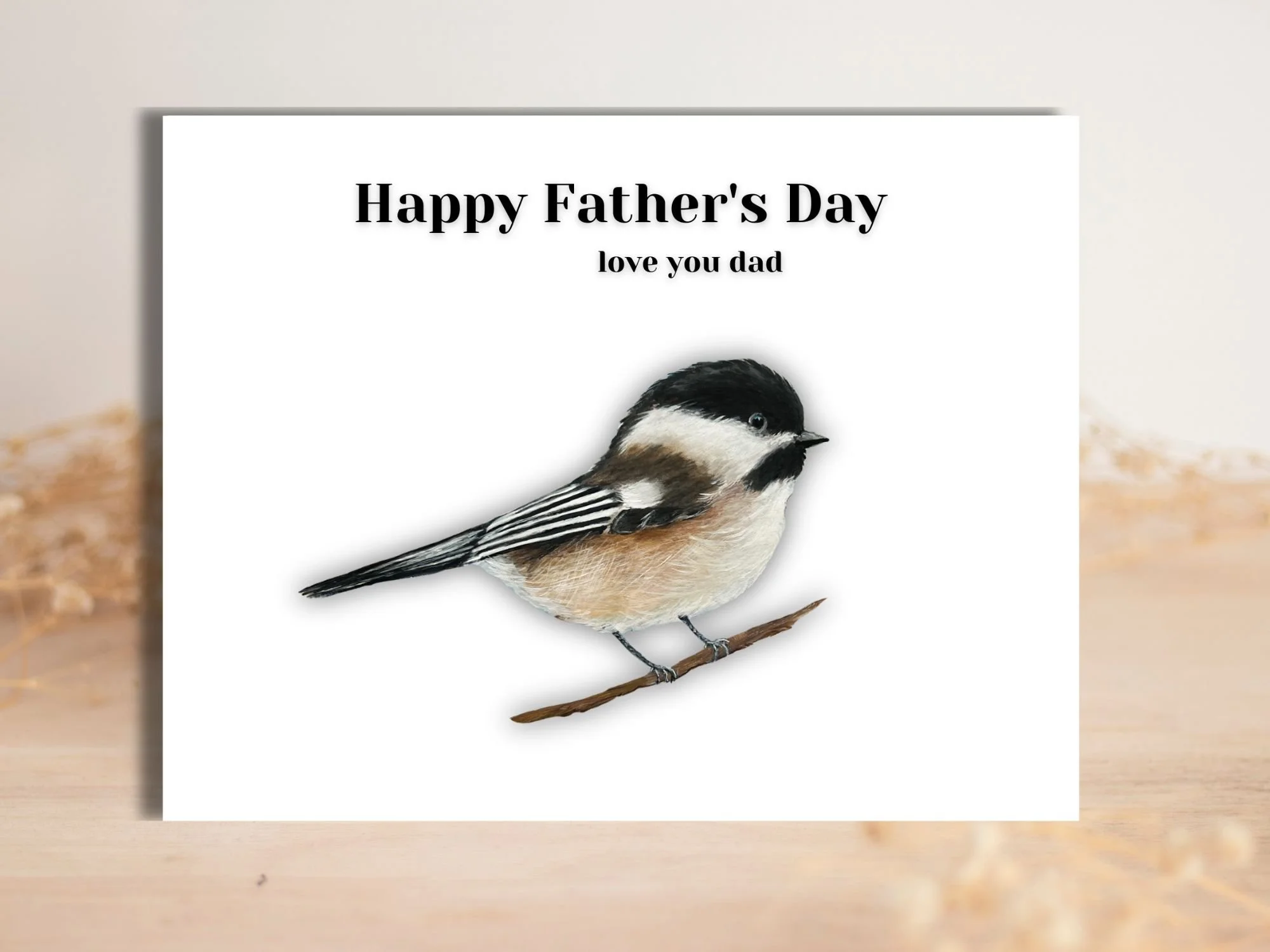 a father's day card with a black capped chickadee facing the right with Happy Fathers Day love you dad above it.  Its is a print of an acrylic painting by artist Maureen MacKenzie