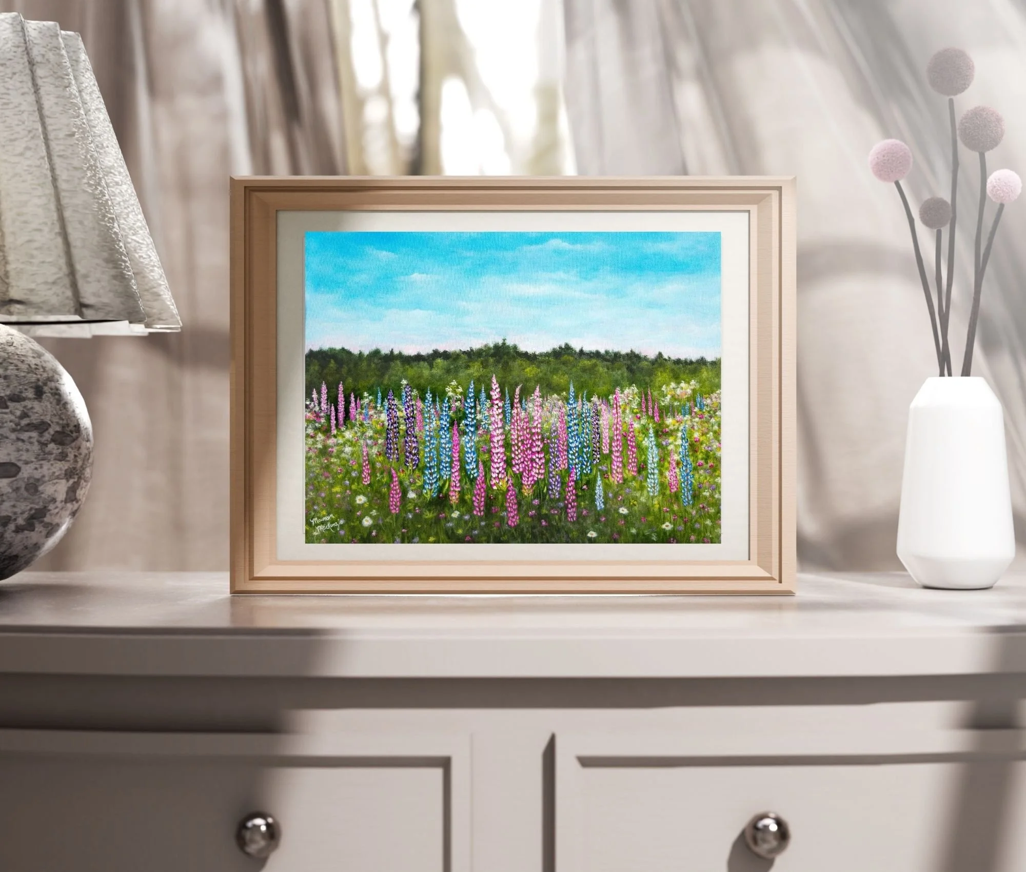 a framed print of a print of a colorful field of pink and purple lupines in bloom under a pale blue sky,