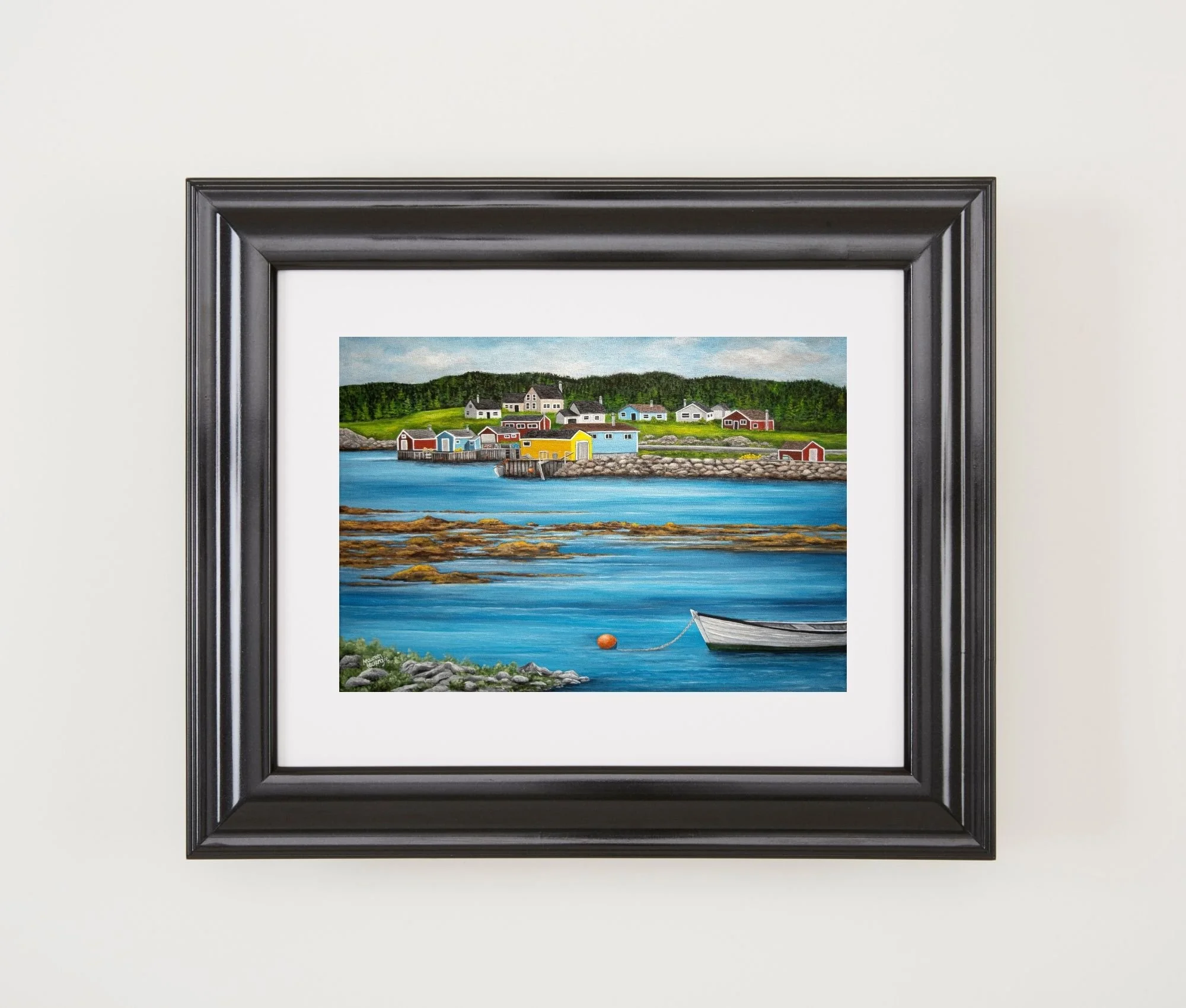 A print by Maureen MacKenzie featuring a colourful coastal newfoundland village, calm blue waters, seaweed flowing over rocks and a white fishing skiff moored to an orange fishing buoy..