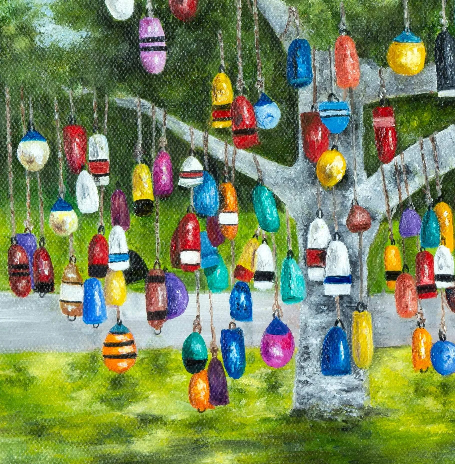 A close up of a print of a colourful buoy tree in Prince Edward Island, reproduced from an original oil painting featuring colorful hanging fishing buoys beneath a leafy green tree.