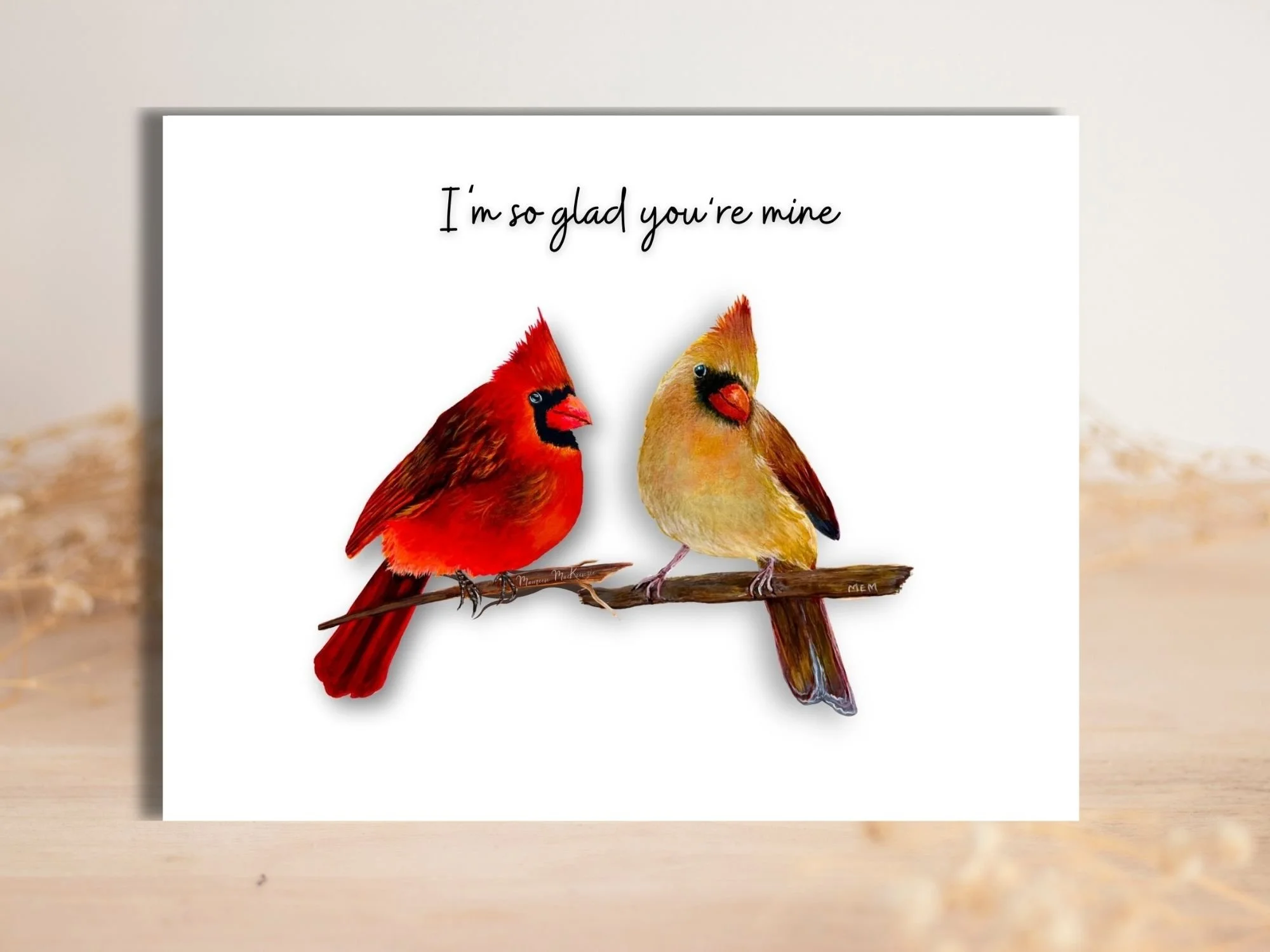 a greeting card of a male and female cardinal perched on a branch facing each other.  The greeting about them says I'm so glad you're mine