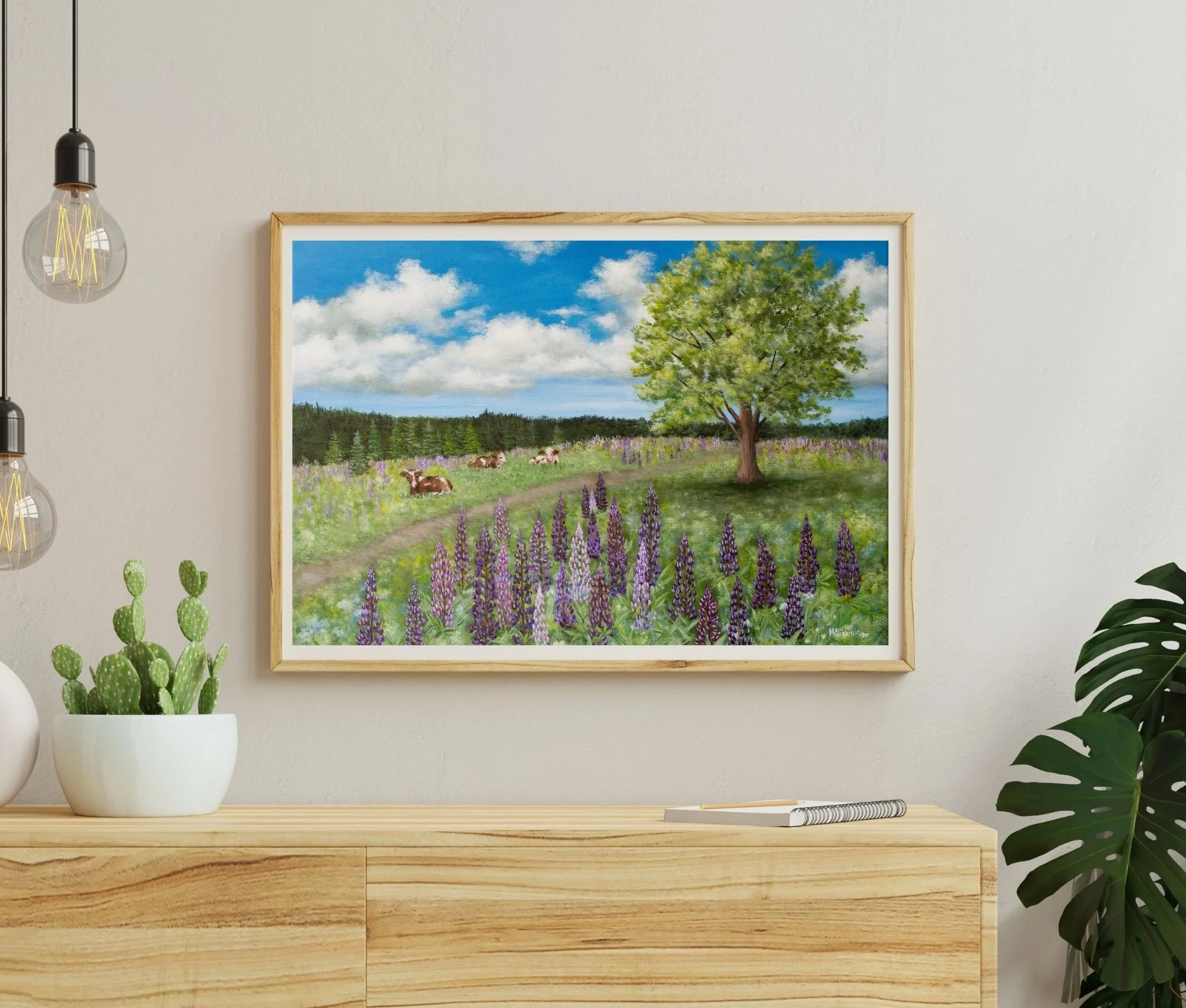 a large format print of an original painting showing cows resting in a peaceful summer pasture surrounded by blooming purple lupines beneath a large shade tree and bright blue sky.