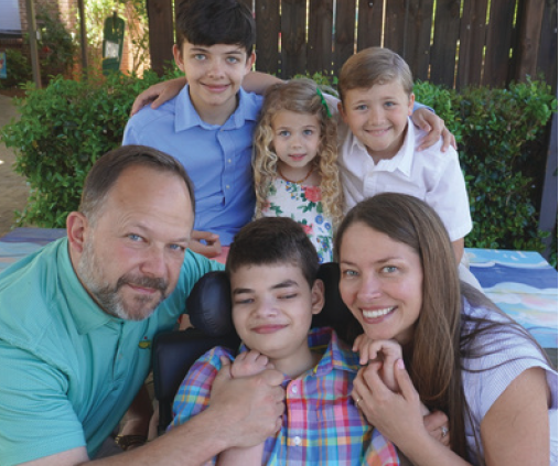 Nolan surrounded by his family.