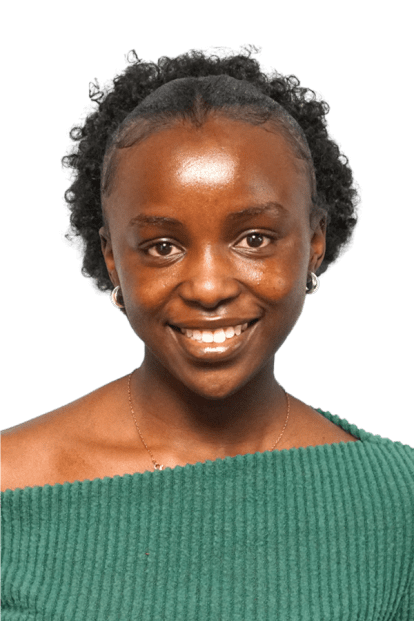 A young woman with dark skin and natural curly hair, smiling, wearing a green top and small earrings.