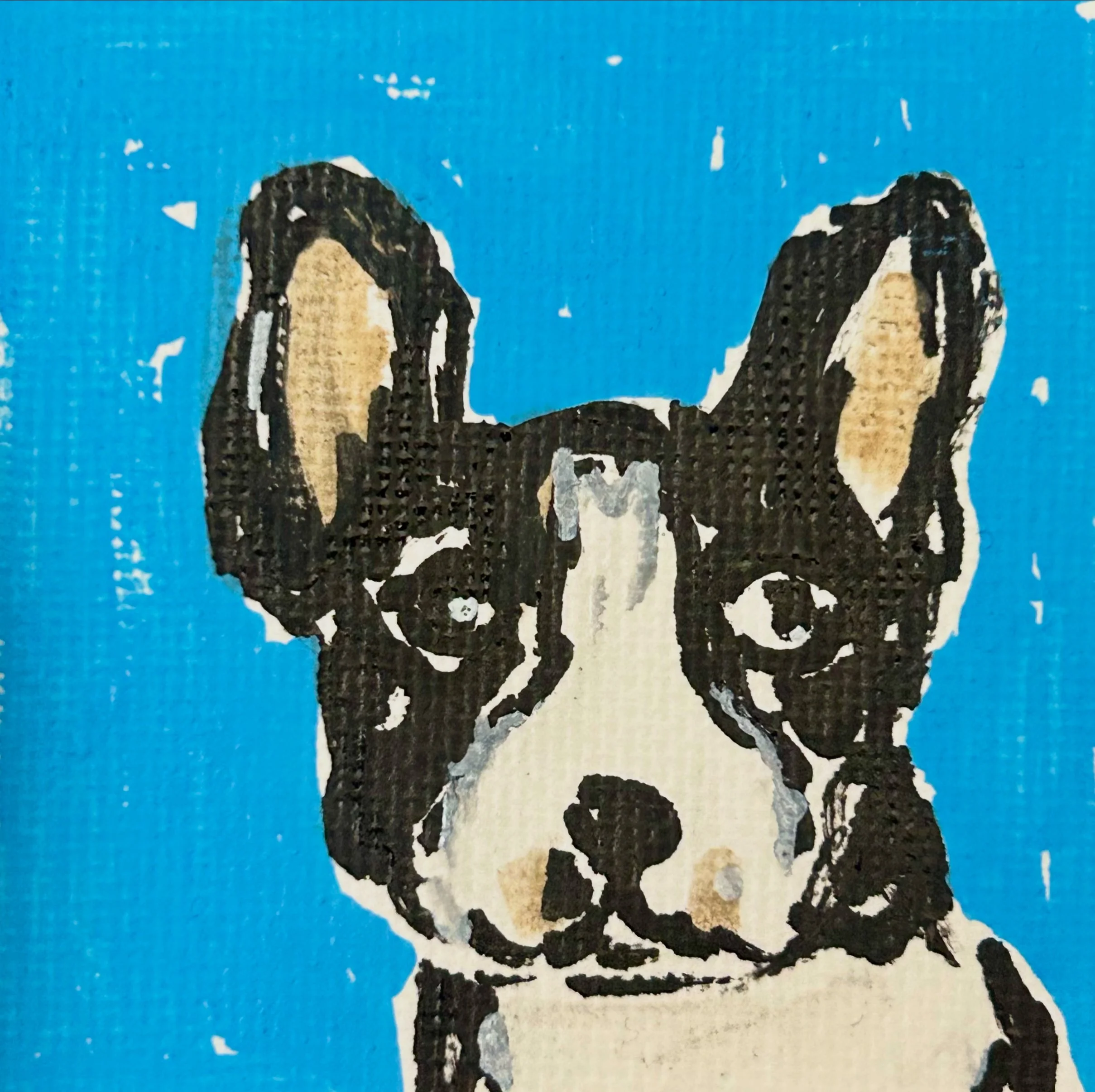 Close-up of a painted portrait of a dog with black, white, and tan fur, set against a blue background.